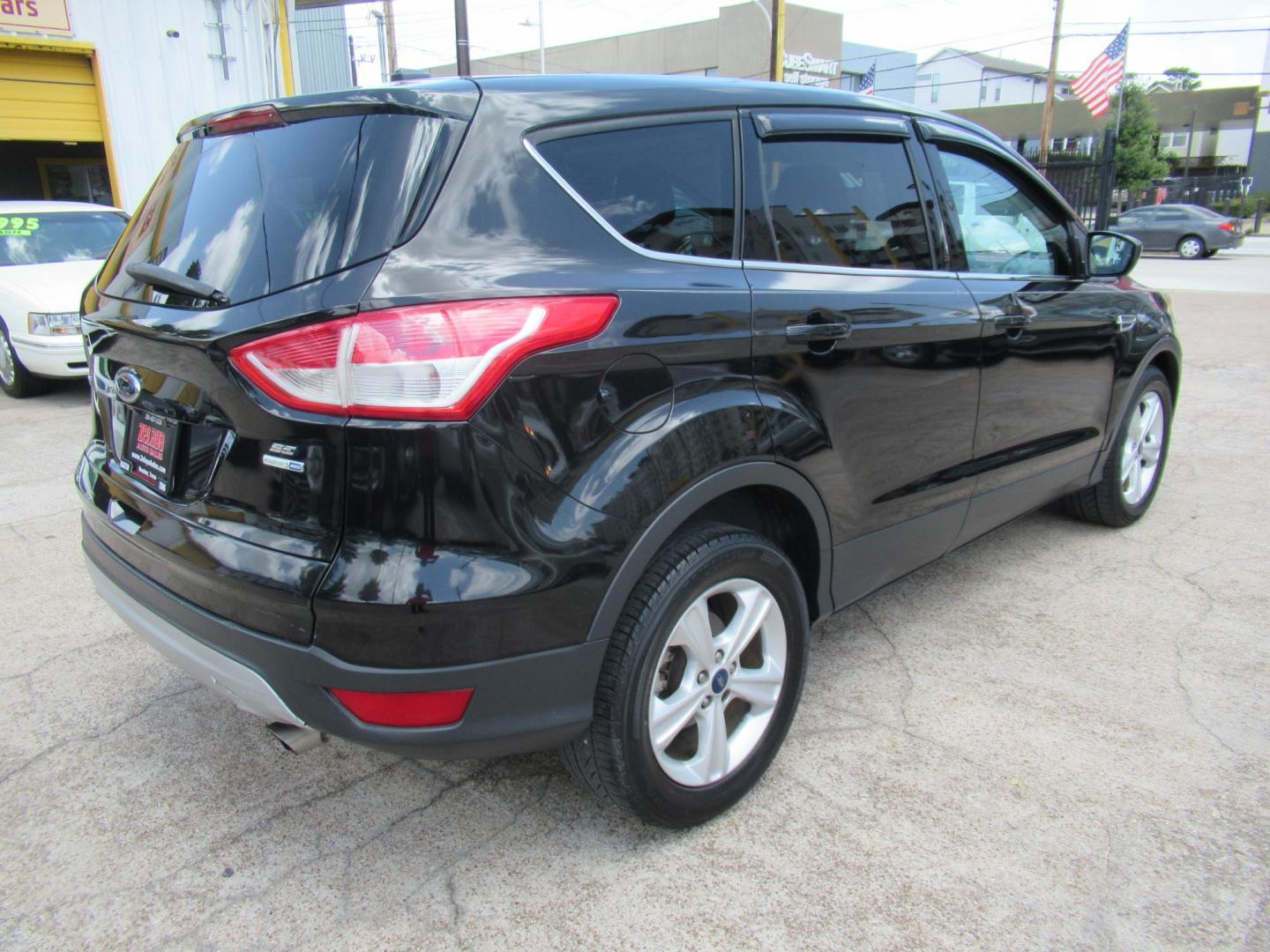 2014 Black /Black Ford Escape SE 4WD (1FMCU9GXXEU) with an 1.6L L4 DOHC 16V engine, Automatic transmission, located at 1511 North Shepherd Dr., Houston, TX, 77008, (281) 657-1221, 29.798361, -95.412560 - 2014 FORD ESCAPE SEVIN: 1FMCU9GXXEUC319764 DOOR WAGON-SPORT UTILITY1.6L I4 F DOHC 16VGASOLINEFRONT WHEEL DRIVE W- 4X4 - Photo#15