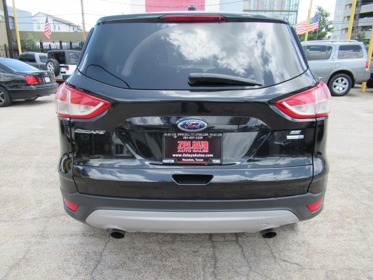 2014 Black /Black Ford Escape SE 4WD (1FMCU9GXXEU) with an 1.6L L4 DOHC 16V engine, Automatic transmission, located at 1511 North Shepherd Dr., Houston, TX, 77008, (281) 657-1221, 29.798361, -95.412560 - 2014 FORD ESCAPE SEVIN: 1FMCU9GXXEUC319764 DOOR WAGON-SPORT UTILITY1.6L I4 F DOHC 16VGASOLINEFRONT WHEEL DRIVE W- 4X4 - Photo#14