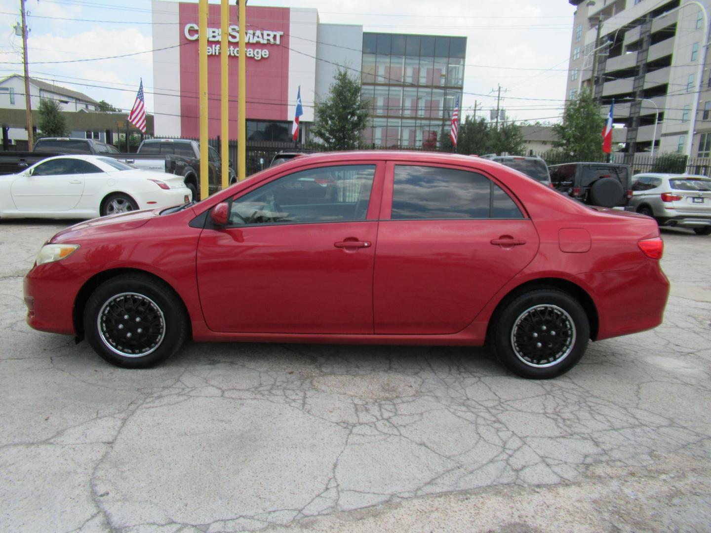 2009 Red /Tan Toyota Corolla Base 4-Speed AT (1NXBU40E09Z) with an 1.8L L4 DOHC 16V engine, Automatic Overdrive transmission, located at 1511 North Shepherd Dr., Houston, TX, 77008, (281) 657-1221, 29.798361, -95.412560 - 2009 TOYOTA COROLLA BASE-S-LE-XLEVIN: 1NXBU40E09Z063536SEDAN 4 DR1.8L I4 F DOHC 16VGASOLINEFRONT WHEEL DRIVE - Photo#13