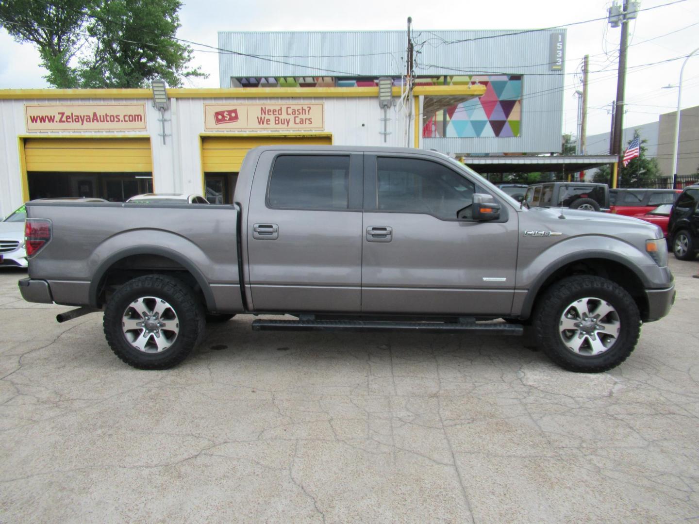 2014 Gray /Black Ford F-150 FX4 SuperCrew 5.5-ft. Bed 4WD (1FTFW1ETXEF) with an 3.5L V6 TURBO engine, Automatic transmission, located at 1511 North Shepherd Dr., Houston, TX, 77008, (281) 657-1221, 29.798361, -95.412560 - 2014 FORD F150 SUPERCREW VIN: 1FTFW1ETXEFB42913 CREW PICKUP 3.5L V6 F DOHC 24V GASOLINE REAR WHEEL DRIVE W/ 4X4- Photo#0