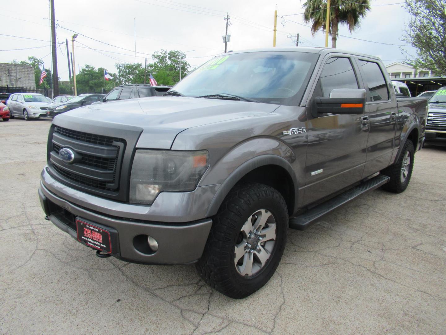 2014 Gray /Black Ford F-150 FX4 SuperCrew 5.5-ft. Bed 4WD (1FTFW1ETXEF) with an 3.5L V6 TURBO engine, Automatic transmission, located at 1511 North Shepherd Dr., Houston, TX, 77008, (281) 657-1221, 29.798361, -95.412560 - 2014 FORD F150 SUPERCREW VIN: 1FTFW1ETXEFB42913 CREW PICKUP 3.5L V6 F DOHC 24V GASOLINE REAR WHEEL DRIVE W/ 4X4- Photo#23