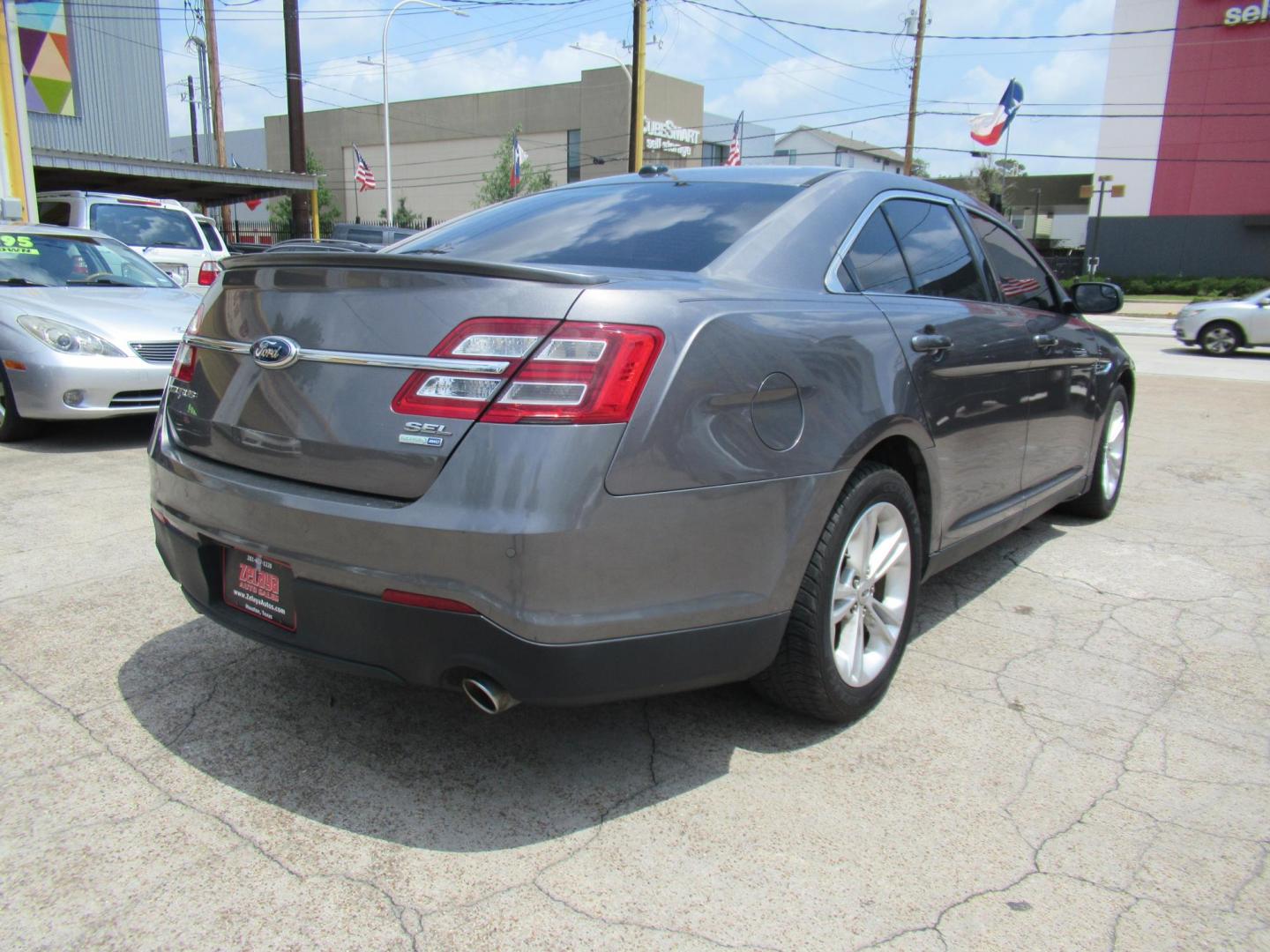 2013 Gray /Black Ford Taurus SEL AWD (1FAHP2H86DG) with an 3.5L V6 DOHC 24V engine, Automatic transmission, located at 1511 North Shepherd Dr., Houston, TX, 77008, (281) 657-1221, 29.798361, -95.412560 - 2013 FORD TAURUS SEL VIN: 1FAHP2H86DG164666 1 F A H P 2 H 8 6 D G 1 6 4 6 6 6 SEDAN 4 DR 3.5L V6 F DOHC 24V GASOLINE ALL WHEEL DRIVE - Photo#21