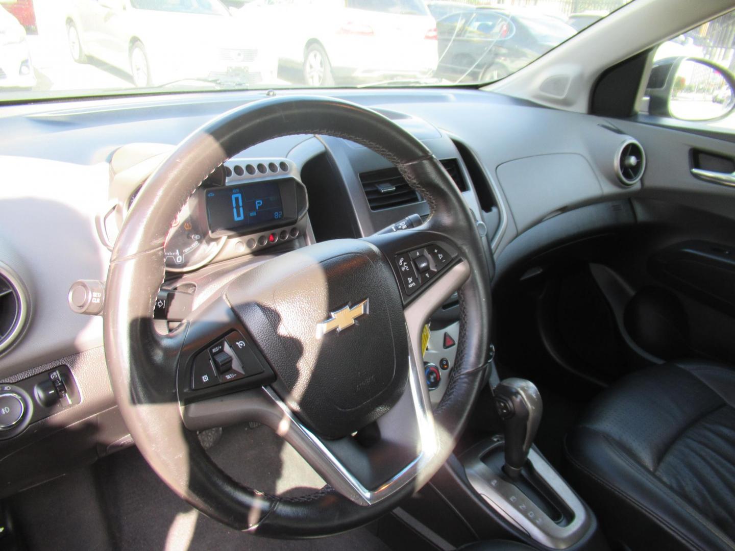 2012 Black /Black Chevrolet Sonic LTZ Sedan (1G1JE5SH0C4) with an 1.8L L4 DOHC 24V FFV engine, Automatic transmission, located at 1511 North Shepherd Dr., Houston, TX, 77008, (281) 657-1221, 29.798361, -95.412560 - 2012 CHEVROLET SONIC LTZ VIN: 1G1JE5SH0C4118352 1 G 1 J E 5 S H 0 C 4 1 1 8 3 5 2 SEDAN 4 DR 1.8L I4 F DOHC 16V GASOLINE FRONT WHEEL DRIVE - Photo#4