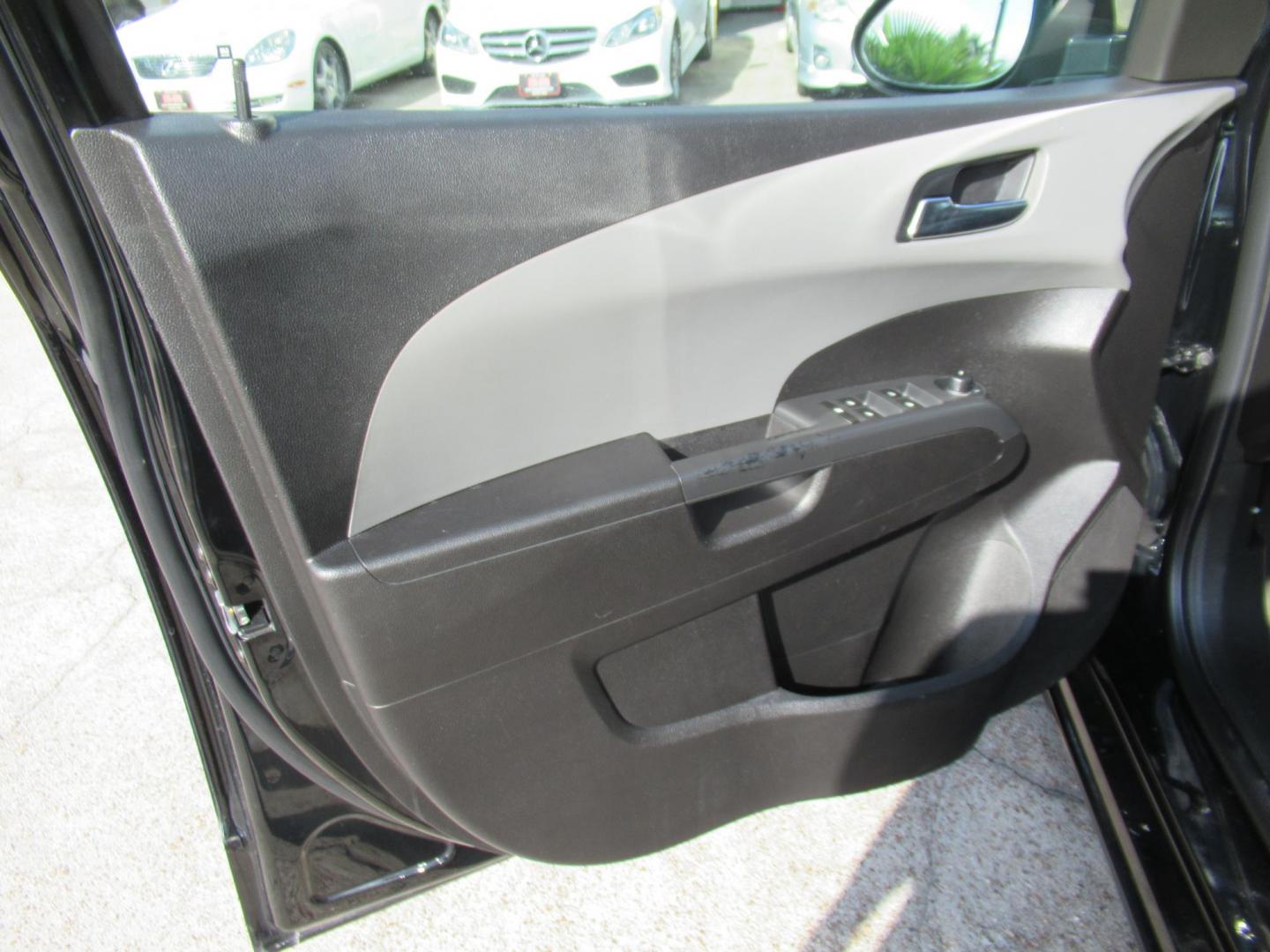 2012 Black /Black Chevrolet Sonic LTZ Sedan (1G1JE5SH0C4) with an 1.8L L4 DOHC 24V FFV engine, Automatic transmission, located at 1511 North Shepherd Dr., Houston, TX, 77008, (281) 657-1221, 29.798361, -95.412560 - 2012 CHEVROLET SONIC LTZ VIN: 1G1JE5SH0C4118352 1 G 1 J E 5 S H 0 C 4 1 1 8 3 5 2 SEDAN 4 DR 1.8L I4 F DOHC 16V GASOLINE FRONT WHEEL DRIVE - Photo#5