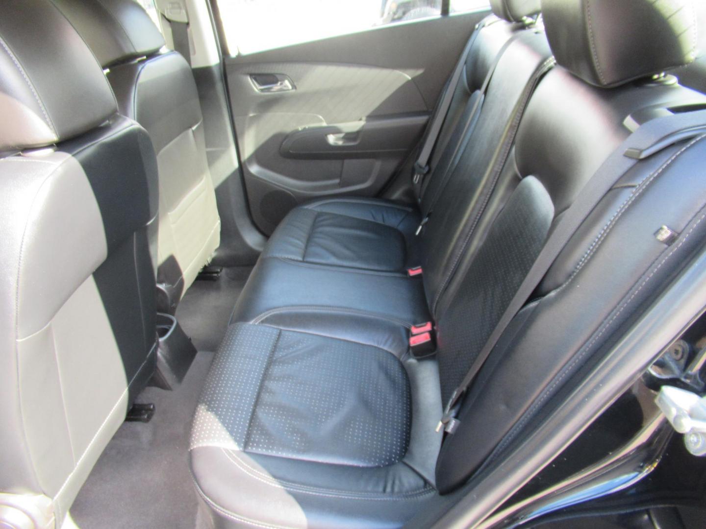 2012 Black /Black Chevrolet Sonic LTZ Sedan (1G1JE5SH0C4) with an 1.8L L4 DOHC 24V FFV engine, Automatic transmission, located at 1511 North Shepherd Dr., Houston, TX, 77008, (281) 657-1221, 29.798361, -95.412560 - 2012 CHEVROLET SONIC LTZ VIN: 1G1JE5SH0C4118352 1 G 1 J E 5 S H 0 C 4 1 1 8 3 5 2 SEDAN 4 DR 1.8L I4 F DOHC 16V GASOLINE FRONT WHEEL DRIVE - Photo#6