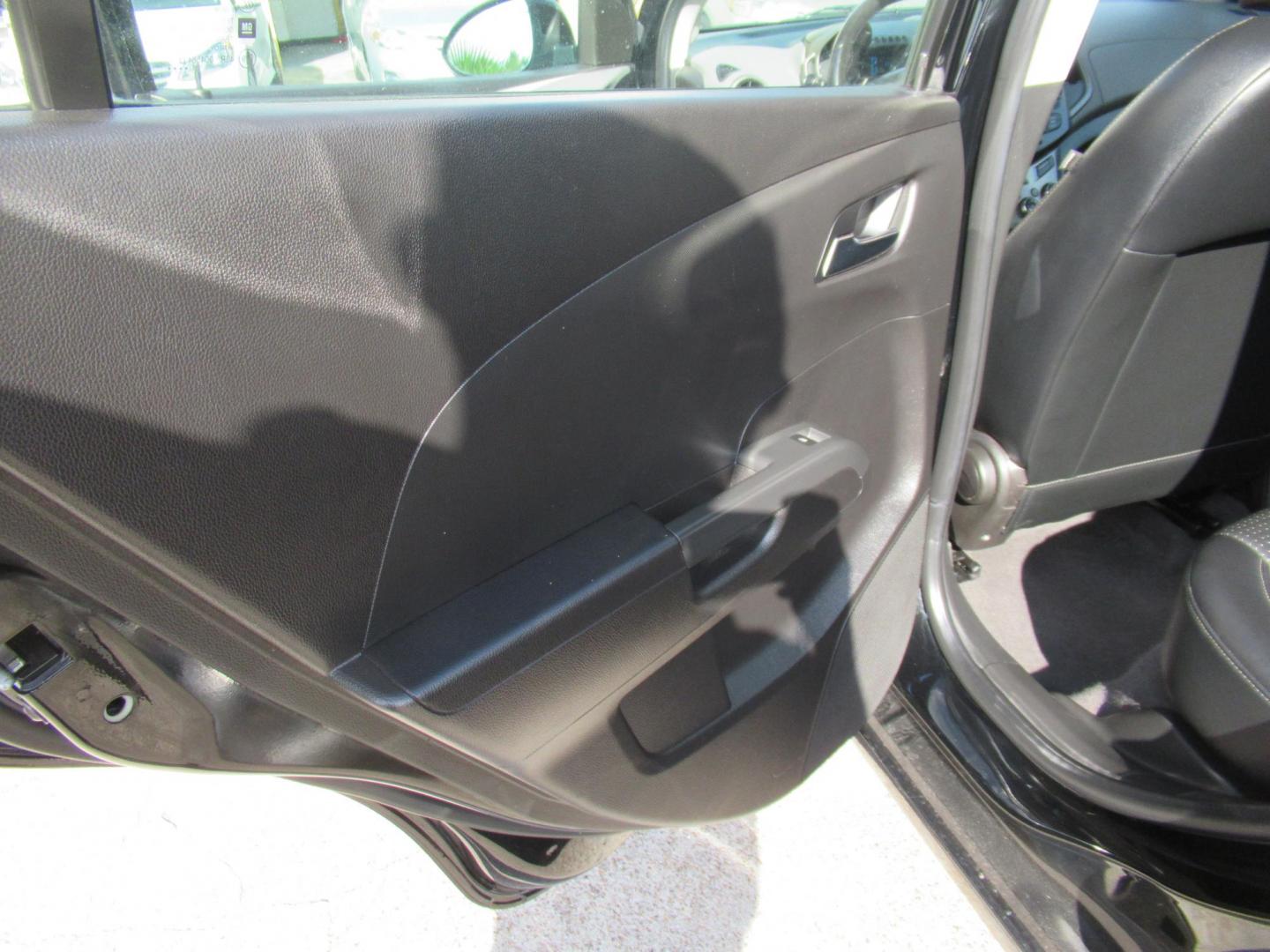 2012 Black /Black Chevrolet Sonic LTZ Sedan (1G1JE5SH0C4) with an 1.8L L4 DOHC 24V FFV engine, Automatic transmission, located at 1511 North Shepherd Dr., Houston, TX, 77008, (281) 657-1221, 29.798361, -95.412560 - 2012 CHEVROLET SONIC LTZ VIN: 1G1JE5SH0C4118352 1 G 1 J E 5 S H 0 C 4 1 1 8 3 5 2 SEDAN 4 DR 1.8L I4 F DOHC 16V GASOLINE FRONT WHEEL DRIVE - Photo#7