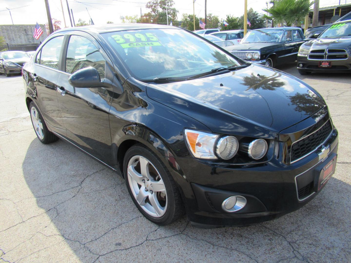 2012 Black /Black Chevrolet Sonic LTZ Sedan (1G1JE5SH0C4) with an 1.8L L4 DOHC 24V FFV engine, Automatic transmission, located at 1511 North Shepherd Dr., Houston, TX, 77008, (281) 657-1221, 29.798361, -95.412560 - 2012 CHEVROLET SONIC LTZ VIN: 1G1JE5SH0C4118352 1 G 1 J E 5 S H 0 C 4 1 1 8 3 5 2 SEDAN 4 DR 1.8L I4 F DOHC 16V GASOLINE FRONT WHEEL DRIVE - Photo#13