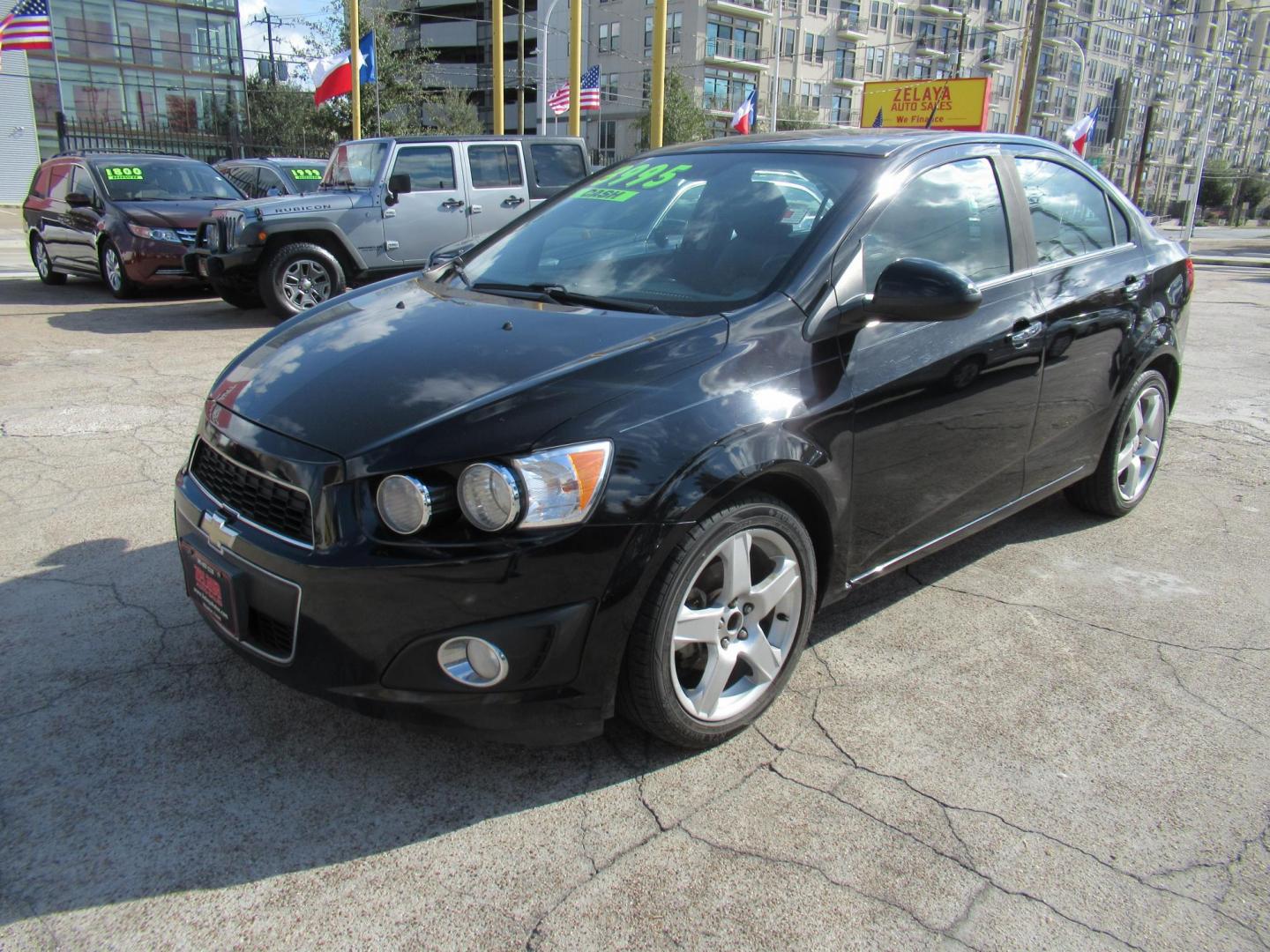 2012 Black /Black Chevrolet Sonic LTZ Sedan (1G1JE5SH0C4) with an 1.8L L4 DOHC 24V FFV engine, Automatic transmission, located at 1511 North Shepherd Dr., Houston, TX, 77008, (281) 657-1221, 29.798361, -95.412560 - 2012 CHEVROLET SONIC LTZ VIN: 1G1JE5SH0C4118352 1 G 1 J E 5 S H 0 C 4 1 1 8 3 5 2 SEDAN 4 DR 1.8L I4 F DOHC 16V GASOLINE FRONT WHEEL DRIVE - Photo#14
