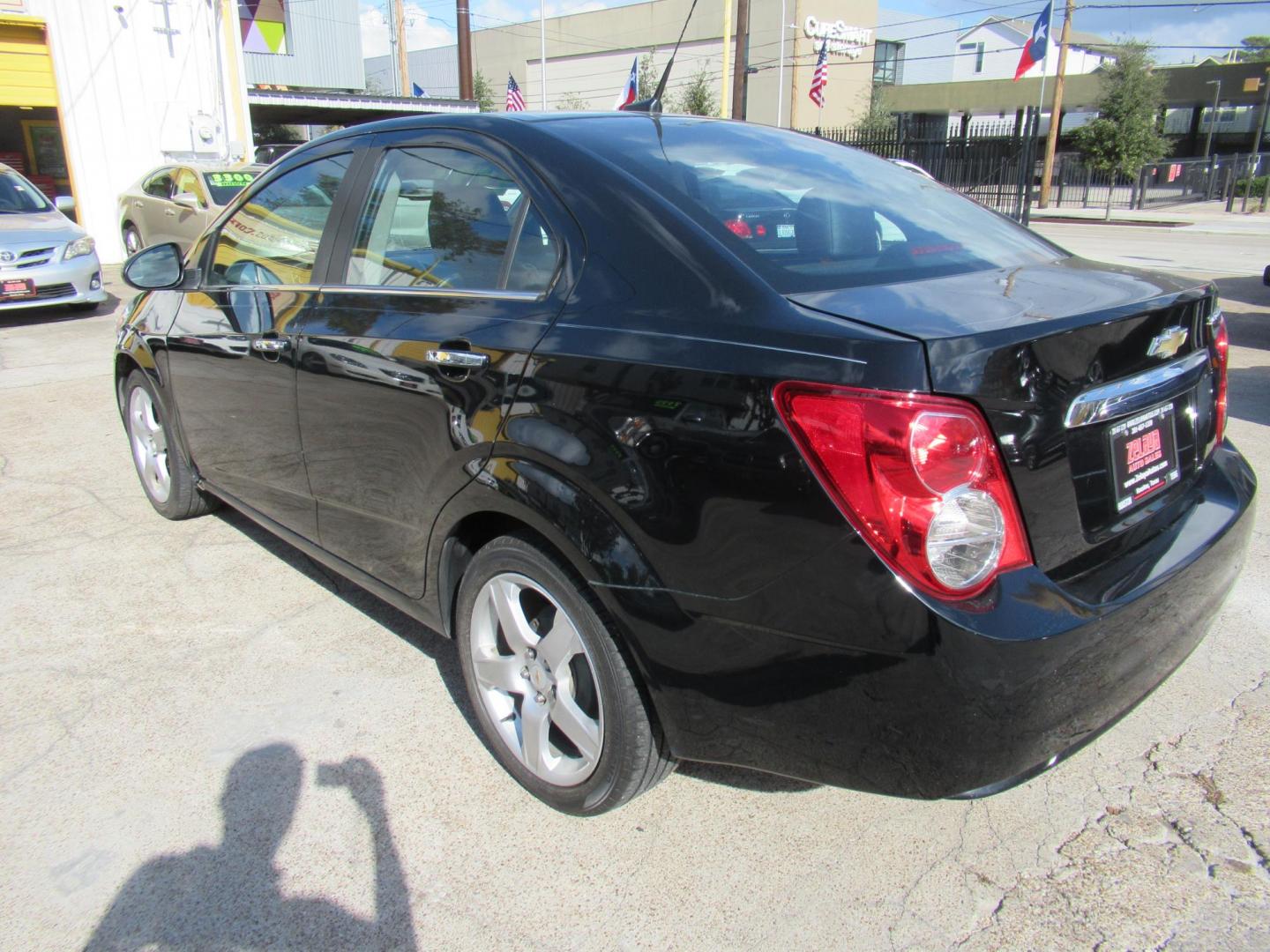 2012 Black /Black Chevrolet Sonic LTZ Sedan (1G1JE5SH0C4) with an 1.8L L4 DOHC 24V FFV engine, Automatic transmission, located at 1511 North Shepherd Dr., Houston, TX, 77008, (281) 657-1221, 29.798361, -95.412560 - 2012 CHEVROLET SONIC LTZ VIN: 1G1JE5SH0C4118352 1 G 1 J E 5 S H 0 C 4 1 1 8 3 5 2 SEDAN 4 DR 1.8L I4 F DOHC 16V GASOLINE FRONT WHEEL DRIVE - Photo#16