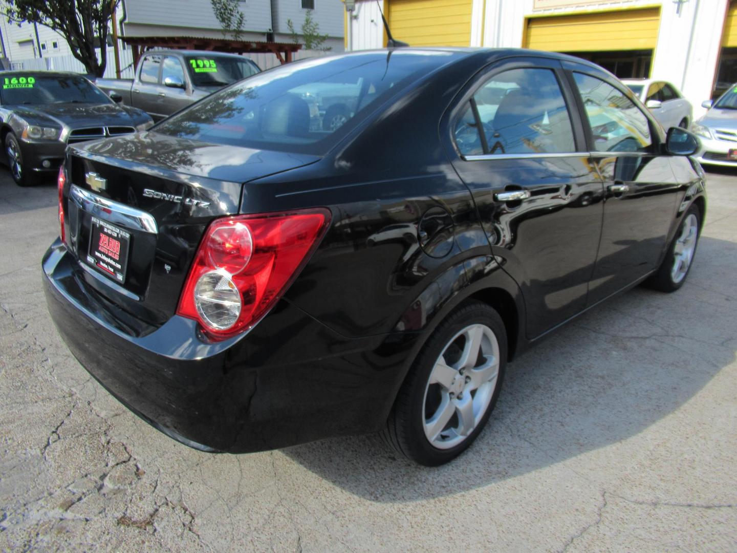 2012 Black /Black Chevrolet Sonic LTZ Sedan (1G1JE5SH0C4) with an 1.8L L4 DOHC 24V FFV engine, Automatic transmission, located at 1511 North Shepherd Dr., Houston, TX, 77008, (281) 657-1221, 29.798361, -95.412560 - 2012 CHEVROLET SONIC LTZ VIN: 1G1JE5SH0C4118352 1 G 1 J E 5 S H 0 C 4 1 1 8 3 5 2 SEDAN 4 DR 1.8L I4 F DOHC 16V GASOLINE FRONT WHEEL DRIVE - Photo#18