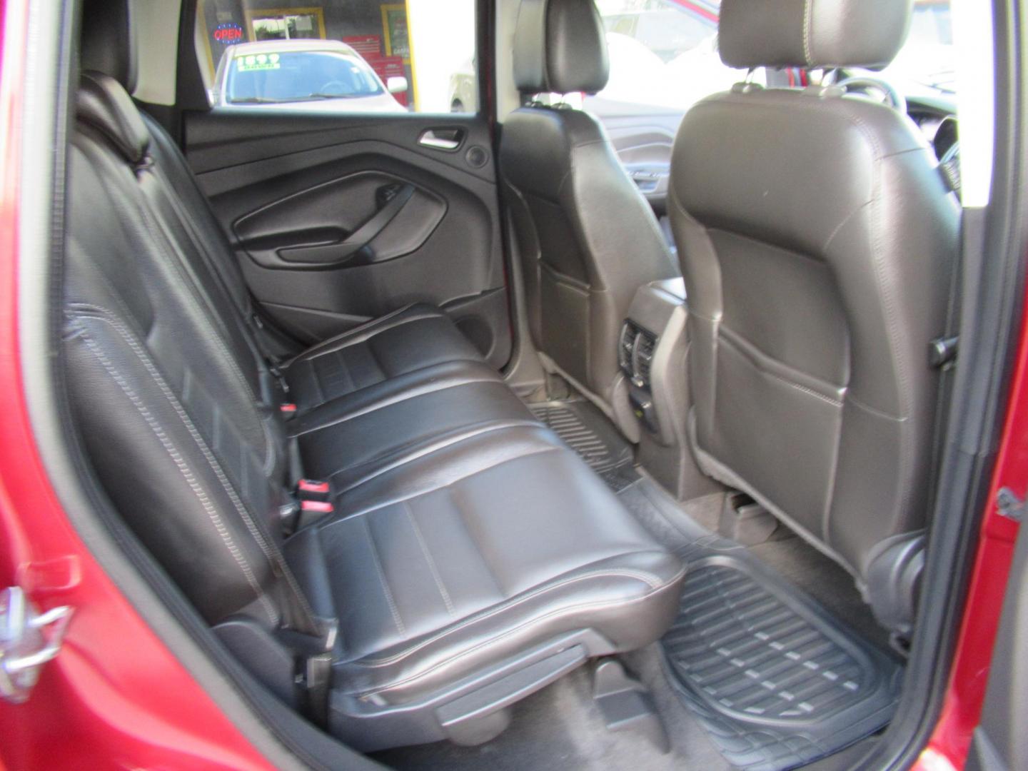 2014 Red /Black Ford Escape Titanium (1FMCU0J98EU) with an 2.0 engine, Automatic transmission, located at 1511 North Shepherd Dr., Houston, TX, 77008, (281) 657-1221, 29.798361, -95.412560 - 2014 FORD ESCAPE TITANIUM VIN: 1FMCU0J98EUA29272 1 F M C U 0 J 9 8 E U A 2 9 2 7 2 4 DOOR WAGON/SPORT UTILITY 2.0L I4 F DOHC 16V GASOLINE FRONT WHEEL DRIVE - Photo#12