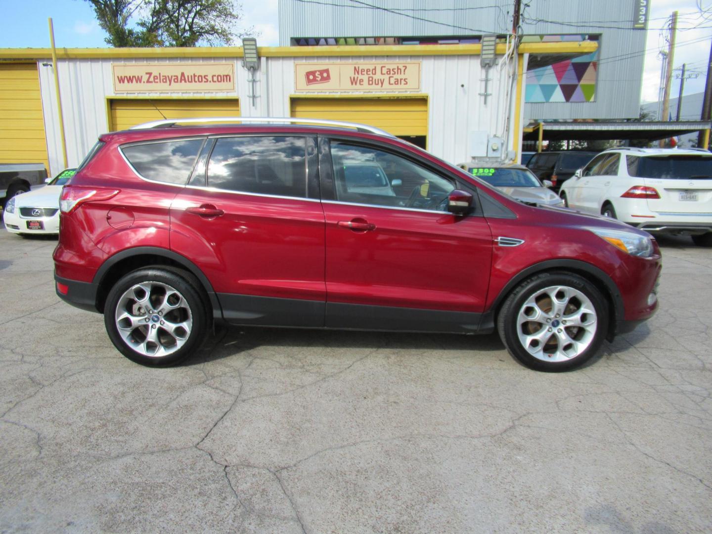 2014 Red /Black Ford Escape Titanium (1FMCU0J98EU) with an 2.0 engine, Automatic transmission, located at 1511 North Shepherd Dr., Houston, TX, 77008, (281) 657-1221, 29.798361, -95.412560 - 2014 FORD ESCAPE TITANIUM VIN: 1FMCU0J98EUA29272 1 F M C U 0 J 9 8 E U A 2 9 2 7 2 4 DOOR WAGON/SPORT UTILITY 2.0L I4 F DOHC 16V GASOLINE FRONT WHEEL DRIVE - Photo#17