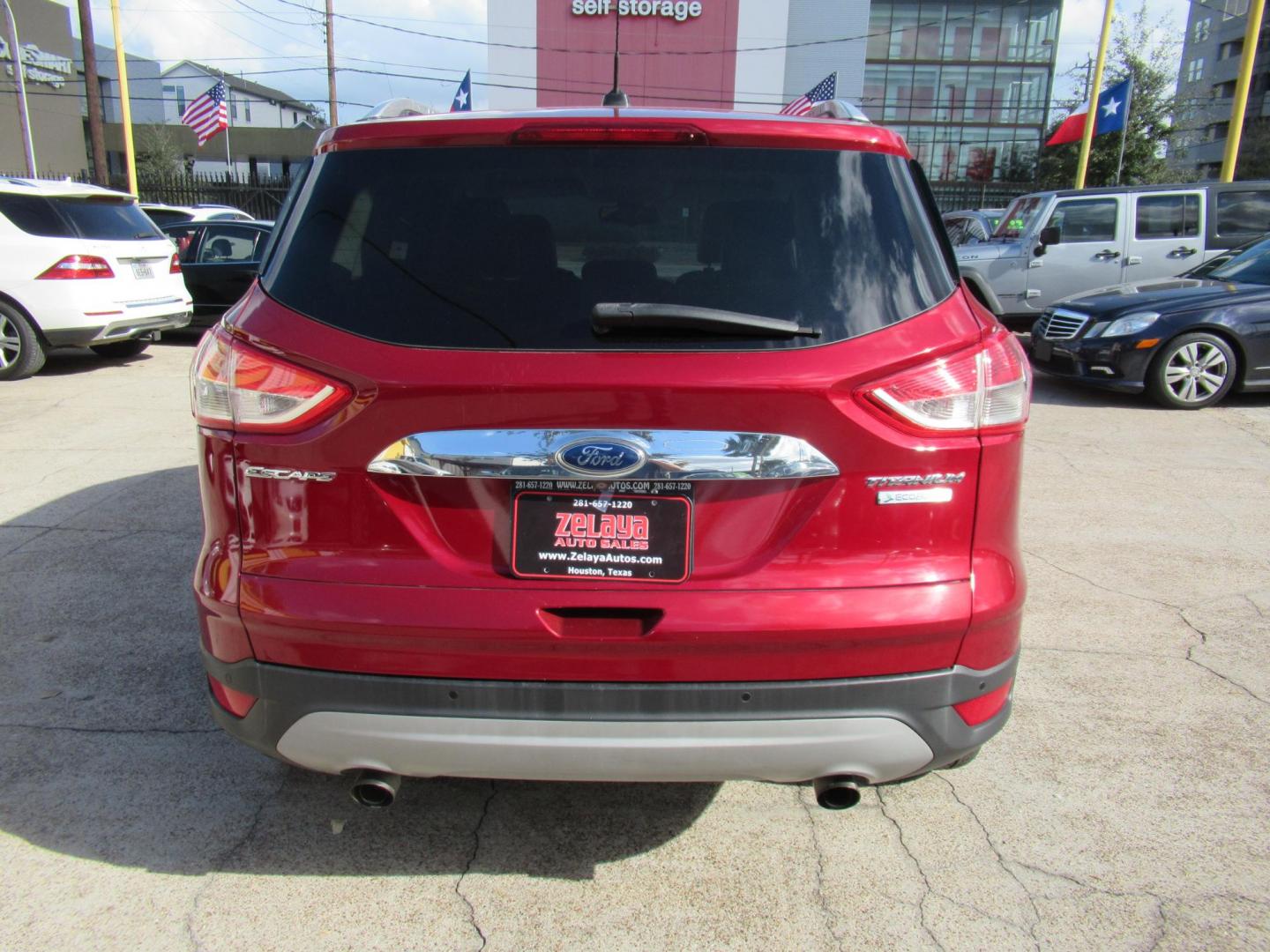 2014 Red /Black Ford Escape Titanium (1FMCU0J98EU) with an 2.0 engine, Automatic transmission, located at 1511 North Shepherd Dr., Houston, TX, 77008, (281) 657-1221, 29.798361, -95.412560 - 2014 FORD ESCAPE TITANIUM VIN: 1FMCU0J98EUA29272 1 F M C U 0 J 9 8 E U A 2 9 2 7 2 4 DOOR WAGON/SPORT UTILITY 2.0L I4 F DOHC 16V GASOLINE FRONT WHEEL DRIVE - Photo#18