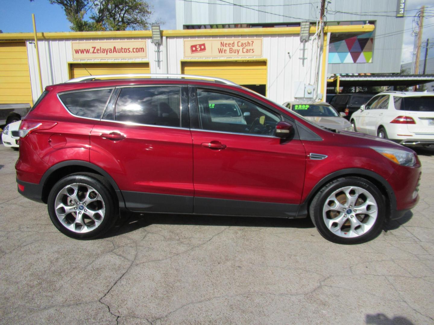 2014 Red /Black Ford Escape Titanium (1FMCU0J98EU) with an 2.0 engine, Automatic transmission, located at 1511 North Shepherd Dr., Houston, TX, 77008, (281) 657-1221, 29.798361, -95.412560 - 2014 FORD ESCAPE TITANIUM VIN: 1FMCU0J98EUA29272 1 F M C U 0 J 9 8 E U A 2 9 2 7 2 4 DOOR WAGON/SPORT UTILITY 2.0L I4 F DOHC 16V GASOLINE FRONT WHEEL DRIVE - Photo#20