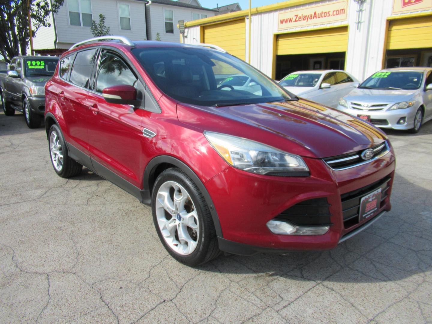 2014 Red /Black Ford Escape Titanium (1FMCU0J98EU) with an 2.0 engine, Automatic transmission, located at 1511 North Shepherd Dr., Houston, TX, 77008, (281) 657-1221, 29.798361, -95.412560 - 2014 FORD ESCAPE TITANIUM VIN: 1FMCU0J98EUA29272 1 F M C U 0 J 9 8 E U A 2 9 2 7 2 4 DOOR WAGON/SPORT UTILITY 2.0L I4 F DOHC 16V GASOLINE FRONT WHEEL DRIVE - Photo#22