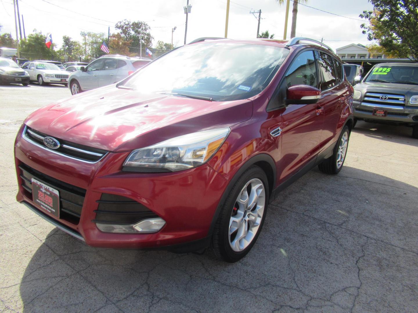 2014 Red /Black Ford Escape Titanium (1FMCU0J98EU) with an 2.0 engine, Automatic transmission, located at 1511 North Shepherd Dr., Houston, TX, 77008, (281) 657-1221, 29.798361, -95.412560 - 2014 FORD ESCAPE TITANIUM VIN: 1FMCU0J98EUA29272 1 F M C U 0 J 9 8 E U A 2 9 2 7 2 4 DOOR WAGON/SPORT UTILITY 2.0L I4 F DOHC 16V GASOLINE FRONT WHEEL DRIVE - Photo#23
