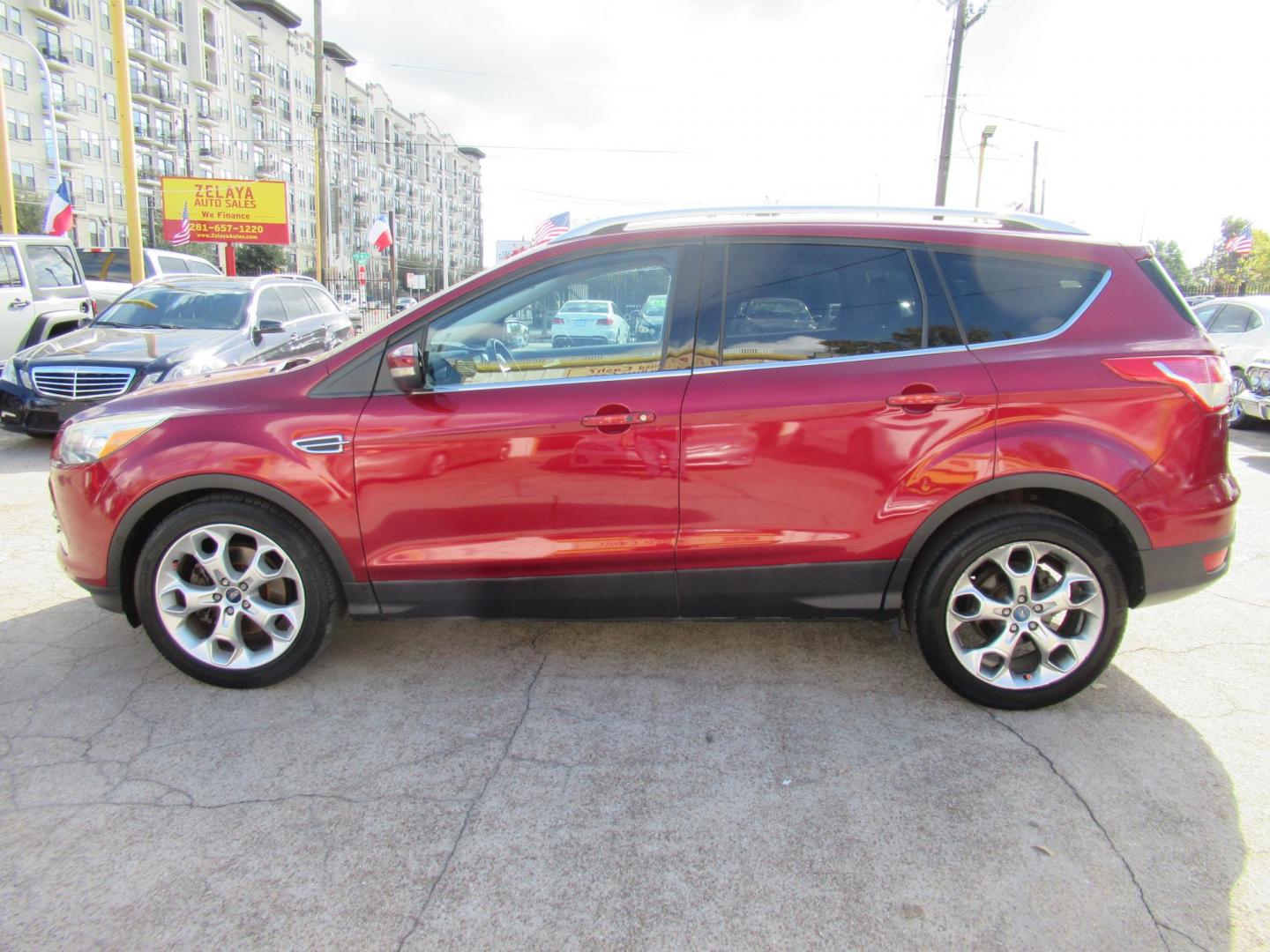2014 Red /Black Ford Escape Titanium (1FMCU0J98EU) with an 2.0 engine, Automatic transmission, located at 1511 North Shepherd Dr., Houston, TX, 77008, (281) 657-1221, 29.798361, -95.412560 - 2014 FORD ESCAPE TITANIUM VIN: 1FMCU0J98EUA29272 1 F M C U 0 J 9 8 E U A 2 9 2 7 2 4 DOOR WAGON/SPORT UTILITY 2.0L I4 F DOHC 16V GASOLINE FRONT WHEEL DRIVE - Photo#24