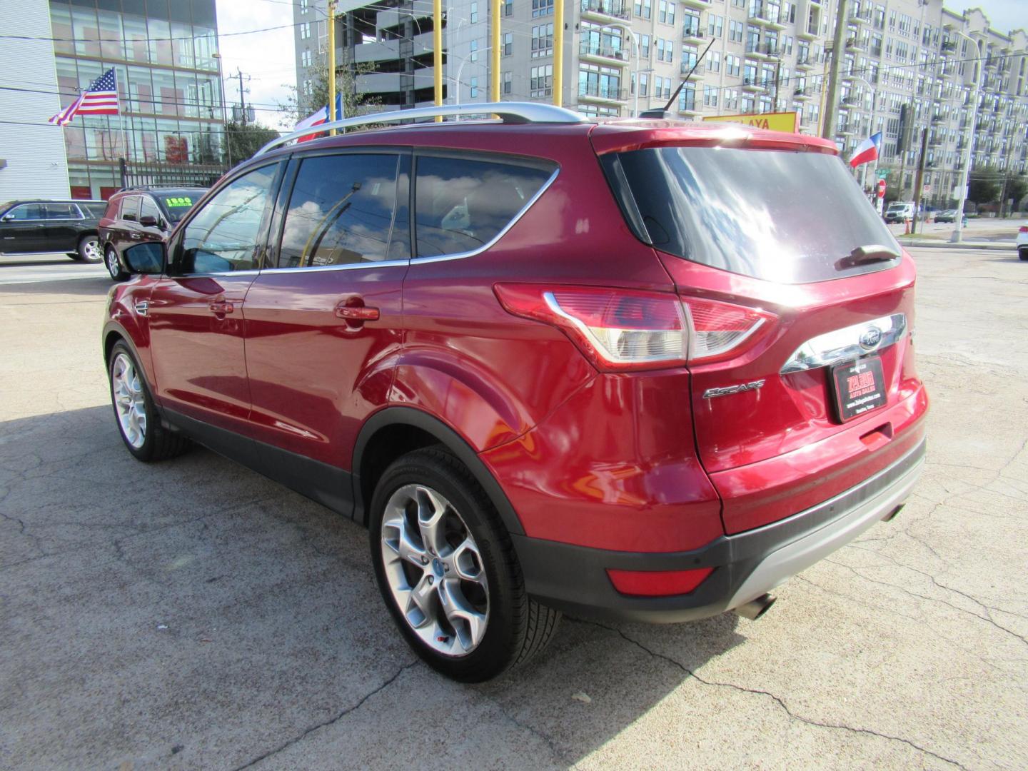 2014 Red /Black Ford Escape Titanium (1FMCU0J98EU) with an 2.0 engine, Automatic transmission, located at 1511 North Shepherd Dr., Houston, TX, 77008, (281) 657-1221, 29.798361, -95.412560 - 2014 FORD ESCAPE TITANIUM VIN: 1FMCU0J98EUA29272 1 F M C U 0 J 9 8 E U A 2 9 2 7 2 4 DOOR WAGON/SPORT UTILITY 2.0L I4 F DOHC 16V GASOLINE FRONT WHEEL DRIVE - Photo#25