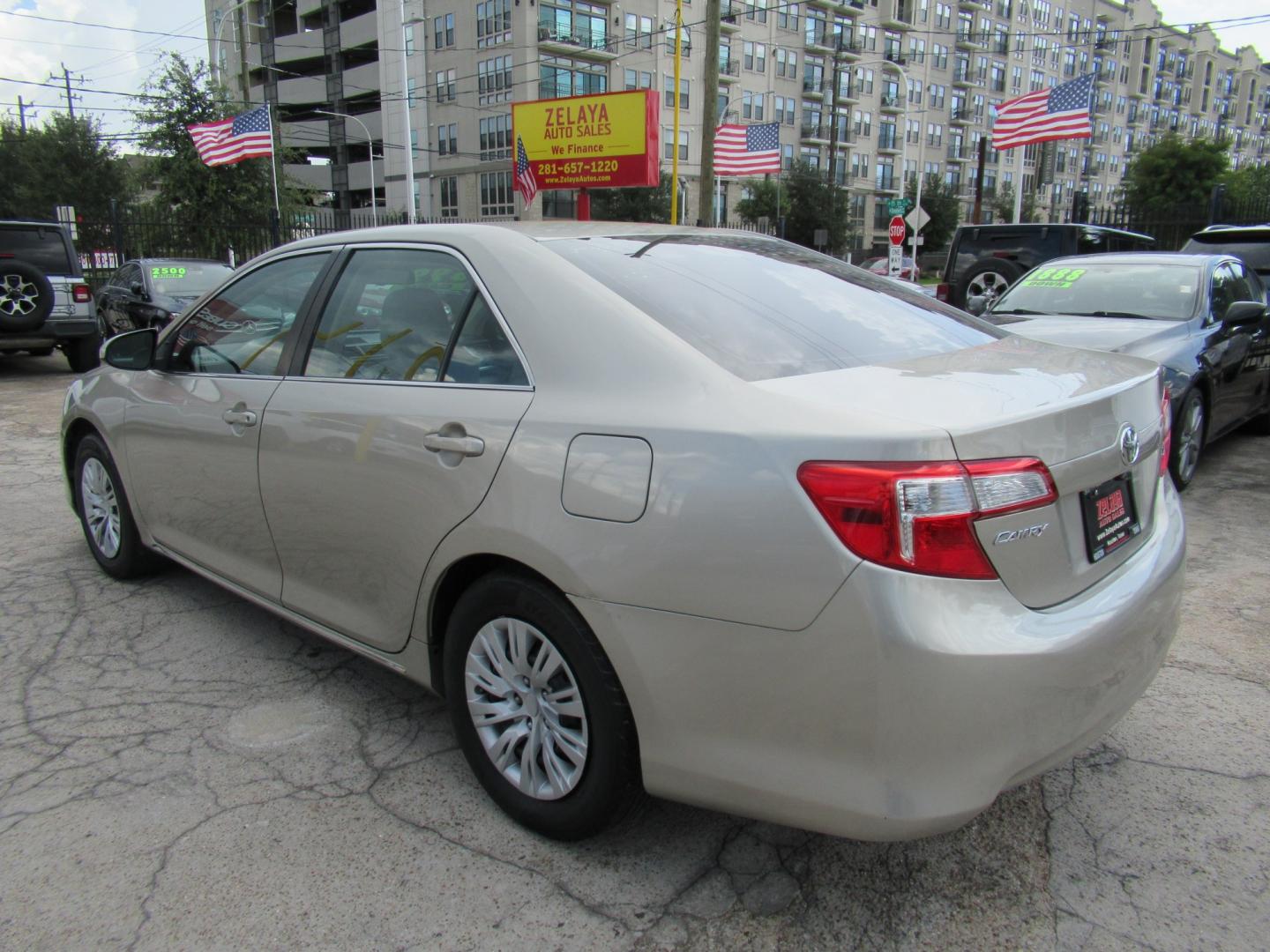 2014 Gold /Tan Toyota Camry L (4T4BF1FK2ER) with an 2.5L L4 DOHC 16V engine, Automatic transmission, located at 1511 North Shepherd Dr., Houston, TX, 77008, (281) 657-1221, 29.798361, -95.412560 - 2014 TOYOTA CAMRY LE VIN: 4T4BF1FK2ER364962 4 T 4 B F 1 F K 2 E R 3 6 4 9 6 2 SEDAN 4 DR 2.5L I4 F DOHC 16V GASOLINE FRONT WHEEL DRIVE- Photo#16