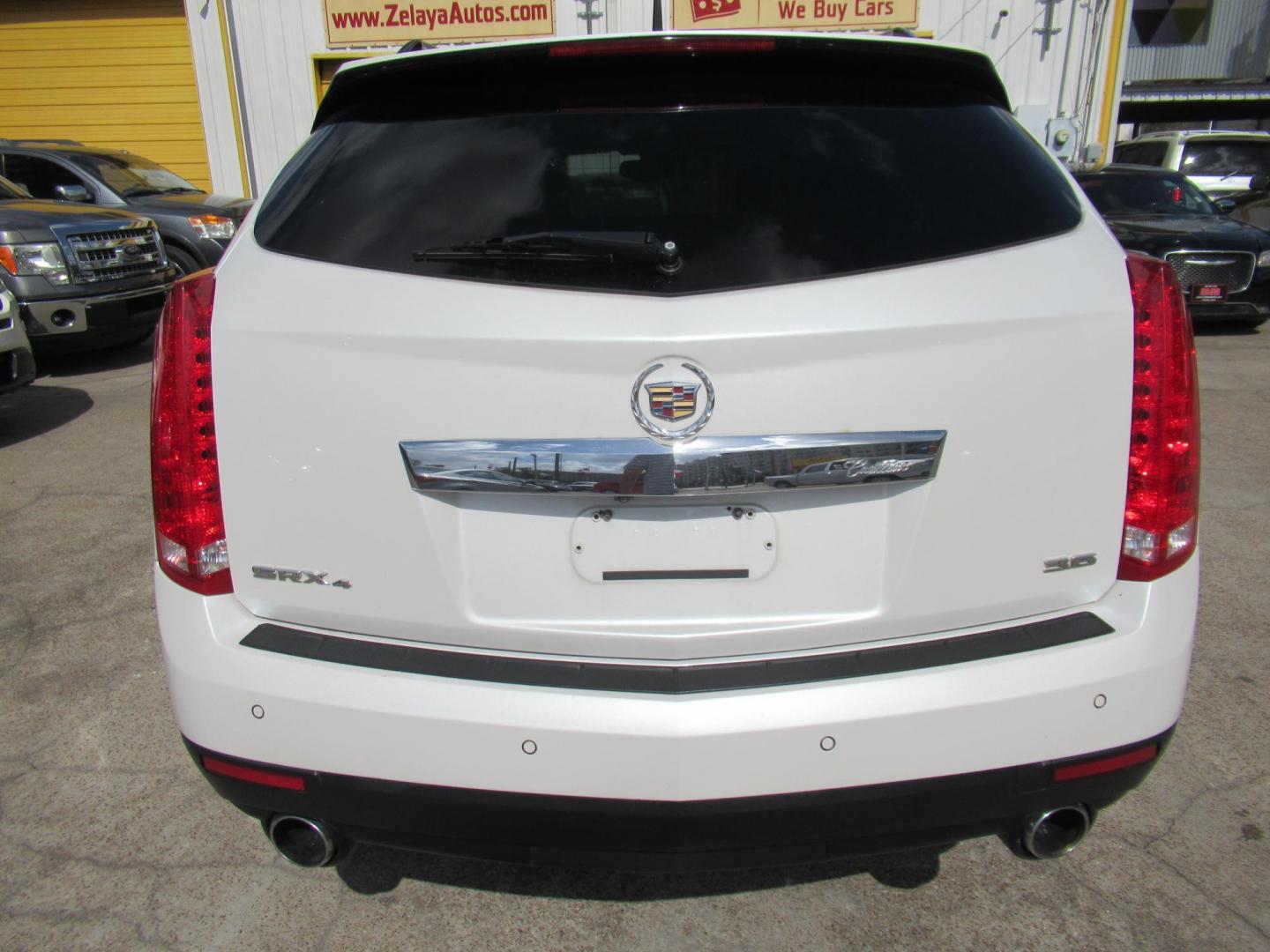 2013 White /Tan Cadillac SRX Base (3GYFNGE37DS) with an 3.6L V6 DOHC 24V FFV engine, Automatic transmission, located at 1511 North Shepherd Dr., Houston, TX, 77008, (281) 657-1221, 29.798361, -95.412560 - 2013 CADILLAC SRX LUXURY COLLECTION VIN: 3GYFNGE37DS645504 3 G Y F N G E 3 7 D S 6 4 5 5 0 4 4 DOOR WAGON/SPORT UTILITY 3.6L V6 F DOHC 24V GASOLINE ALL WHEEL DRIVE - Photo#19