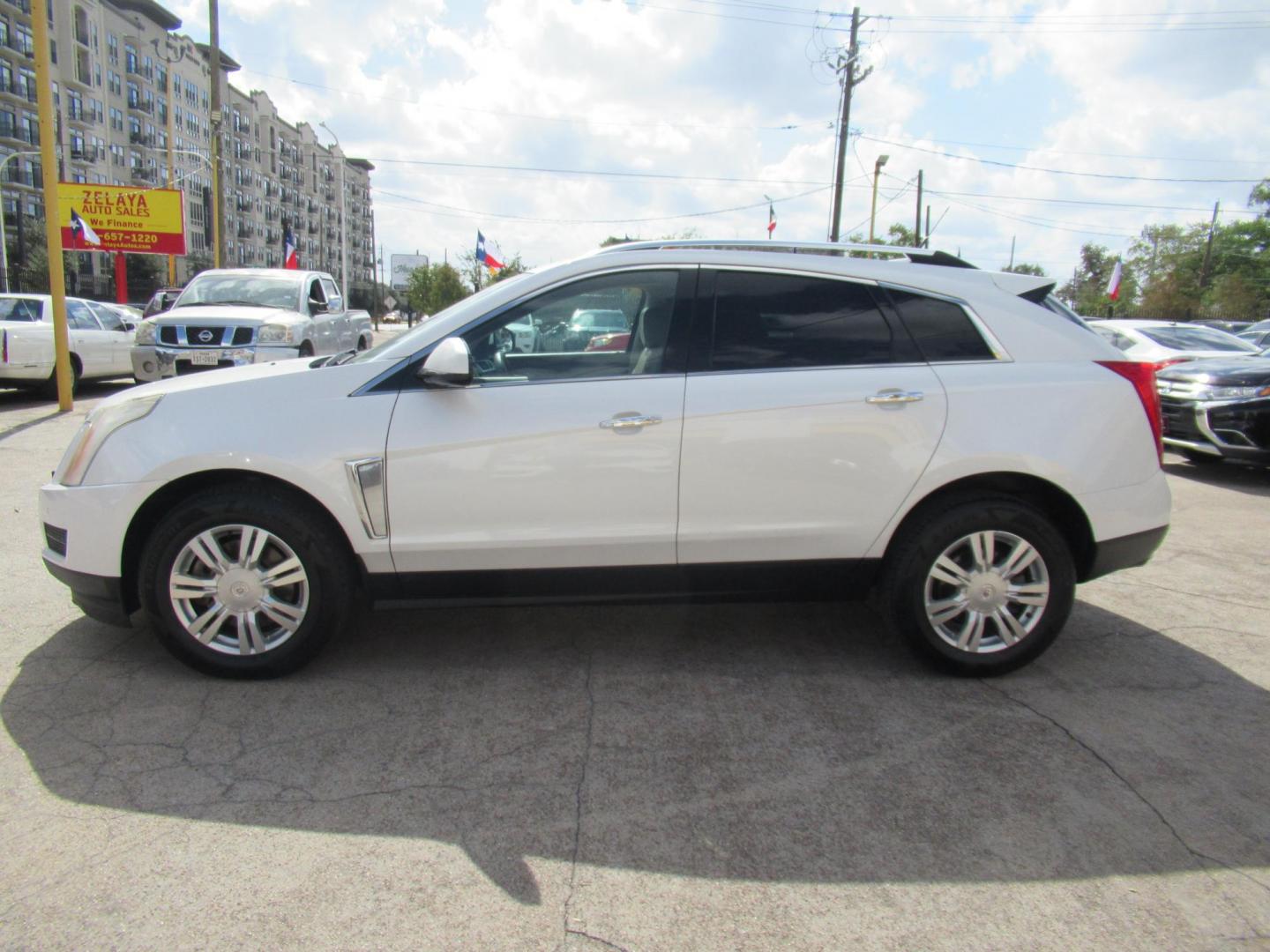 2013 White /Tan Cadillac SRX Base (3GYFNGE37DS) with an 3.6L V6 DOHC 24V FFV engine, Automatic transmission, located at 1511 North Shepherd Dr., Houston, TX, 77008, (281) 657-1221, 29.798361, -95.412560 - 2013 CADILLAC SRX LUXURY COLLECTION VIN: 3GYFNGE37DS645504 3 G Y F N G E 3 7 D S 6 4 5 5 0 4 4 DOOR WAGON/SPORT UTILITY 3.6L V6 F DOHC 24V GASOLINE ALL WHEEL DRIVE - Photo#27