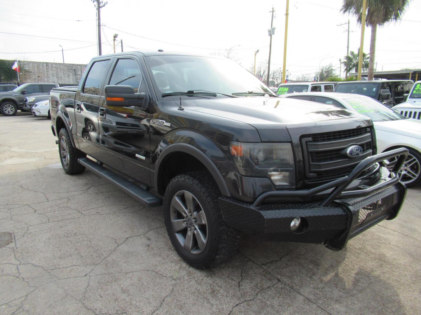 2014 Black /Black Ford F-150 FX4 SuperCrew 5.5-ft. Bed 4WD (1FTFW1ET3EK) with an 3.5L V6 TURBO engine, Automatic transmission, located at 1511 North Shepherd Dr., Houston, TX, 77008, (281) 657-1221, 29.798361, -95.412560 - 2014 FORD F-150 FX4 VIN: 1FTFW1ET3EKF20416 1 F T F W 1 E T 3 E K F 2 0 4 1 6 CREW PICKUP 3.5L V6 F DOHC 24V GASOLINE REAR WHEEL DRIVE W/ 4X4 - Photo#26