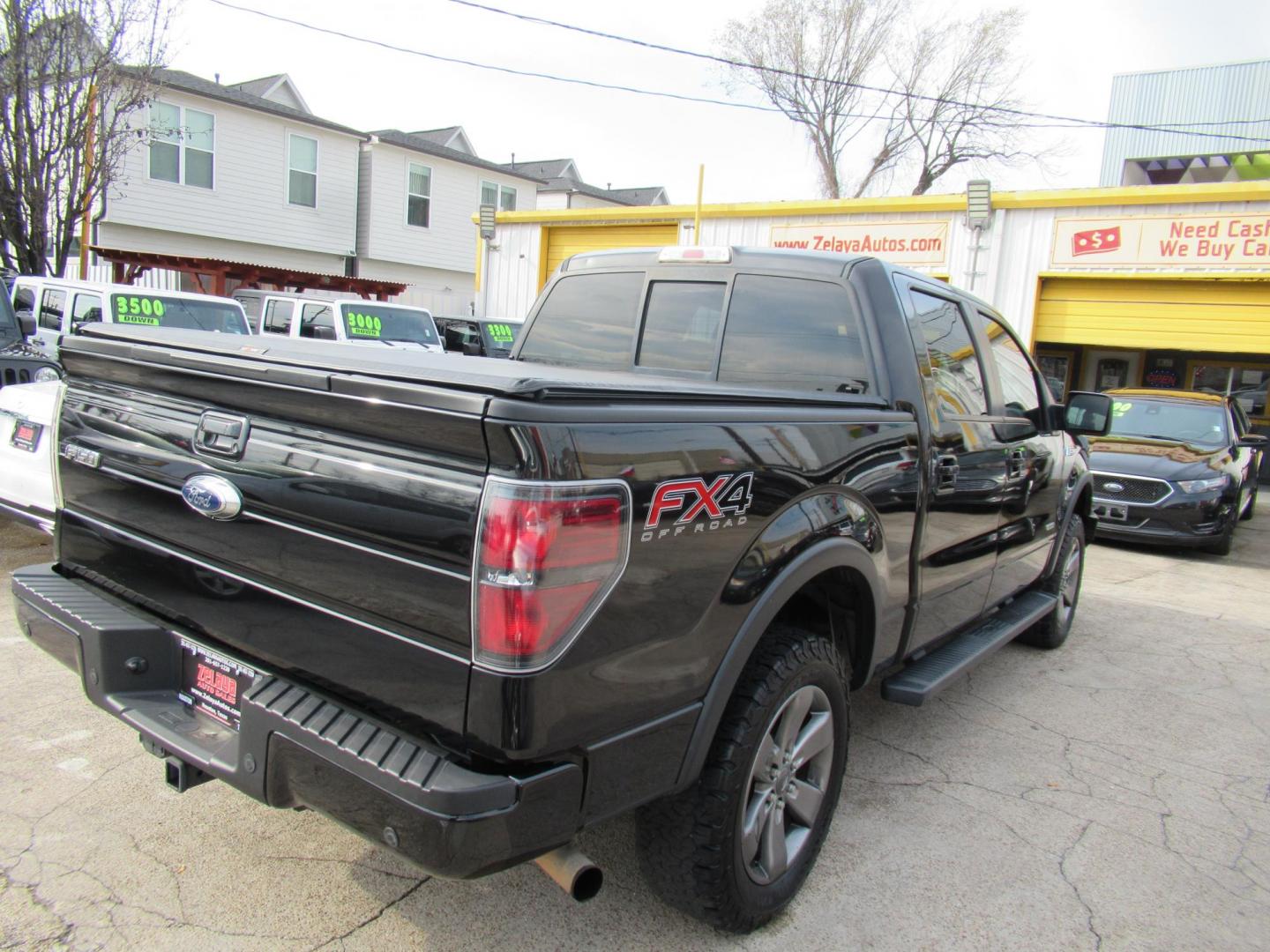 2014 Black /Black Ford F-150 FX4 SuperCrew 5.5-ft. Bed 4WD (1FTFW1ET3EK) with an 3.5L V6 TURBO engine, Automatic transmission, located at 1511 North Shepherd Dr., Houston, TX, 77008, (281) 657-1221, 29.798361, -95.412560 - 2014 FORD F-150 FX4 VIN: 1FTFW1ET3EKF20416 1 F T F W 1 E T 3 E K F 2 0 4 1 6 CREW PICKUP 3.5L V6 F DOHC 24V GASOLINE REAR WHEEL DRIVE W/ 4X4 - Photo#29