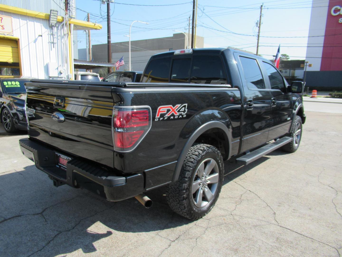 2014 Black /Black Ford F-150 FX4 SuperCrew 5.5-ft. Bed 4WD (1FTFW1ET3EK) with an 3.5L V6 TURBO engine, Automatic transmission, located at 1511 North Shepherd Dr., Houston, TX, 77008, (281) 657-1221, 29.798361, -95.412560 - 2014 FORD F-150 FX4 VIN: 1FTFW1ET3EKF20416 1 F T F W 1 E T 3 E K F 2 0 4 1 6 CREW PICKUP 3.5L V6 F DOHC 24V GASOLINE REAR WHEEL DRIVE W/ 4X4 - Photo#35