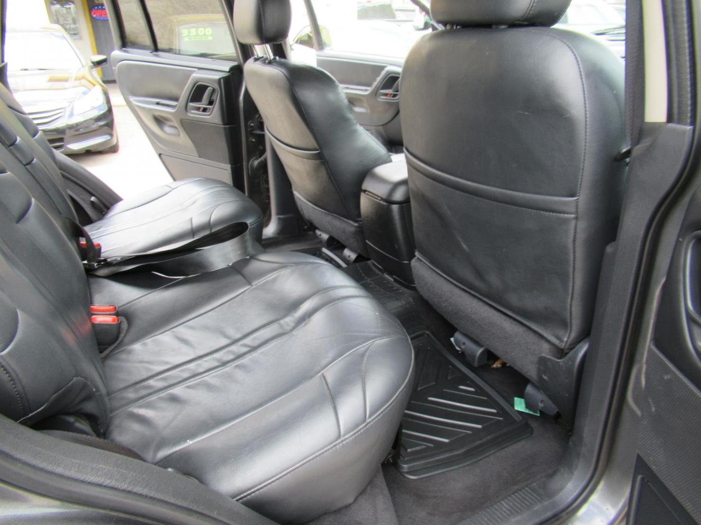 2002 Gray /Black Jeep Grand Cherokee Laredo 4WD (1J4GW48S32C) with an 4.0L L6 OHV 12V engine, 4-Speed Automatic Overdrive transmission, located at 1511 North Shepherd Dr., Houston, TX, 77008, (281) 657-1221, 29.798361, -95.412560 - 2002 JEEP GRAND CHEROKEE LAREDO VIN: 1J4GW48S32C228645 1 J 4 G W 4 8 S 3 2 C 2 2 8 6 4 5 4 DOOR WAGON/SPORT UTILITY 4.0L I6 F GASOLINE REAR WHEEL DRIVE W/ 4X4 - Photo#14