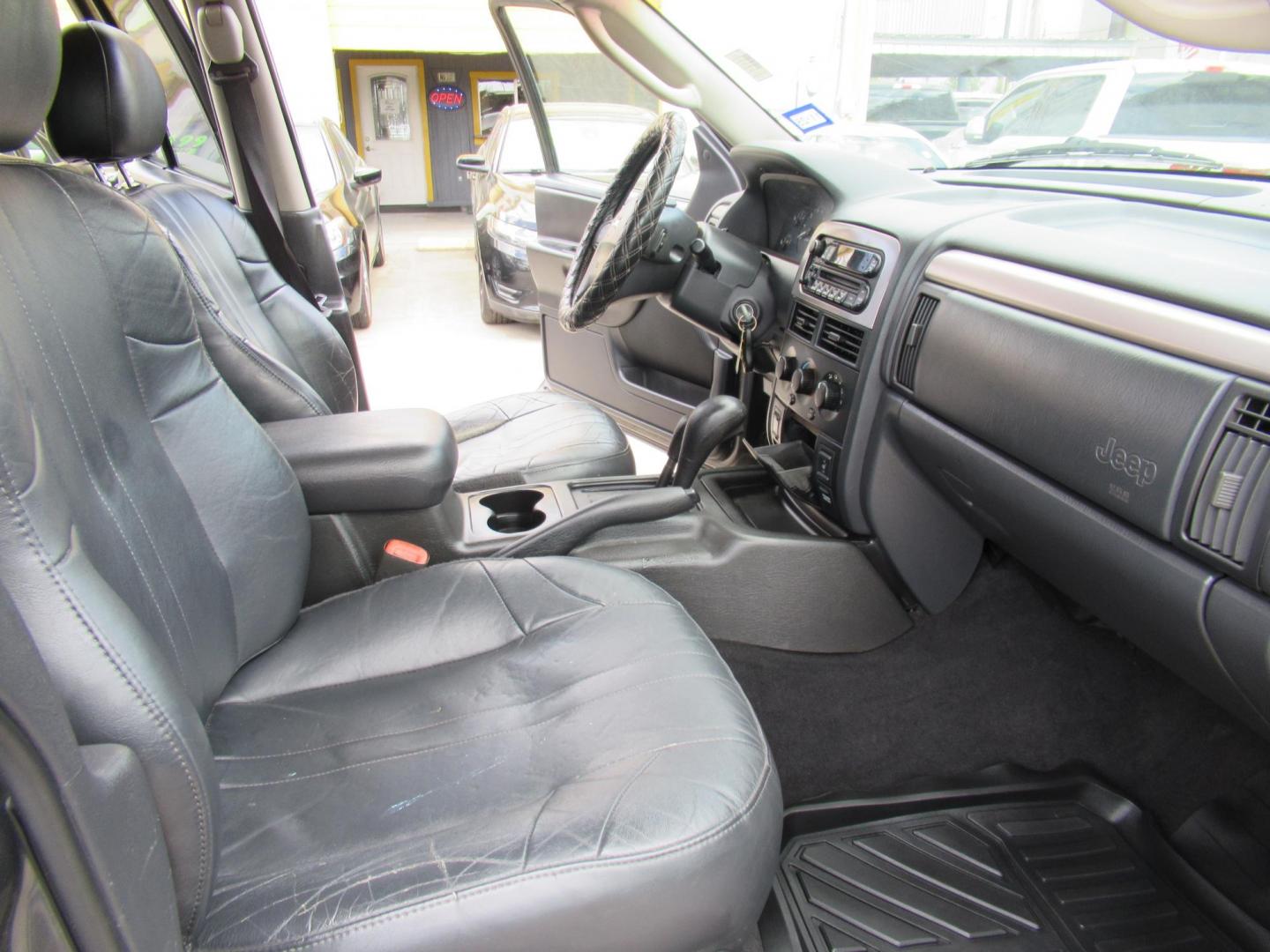 2002 Gray /Black Jeep Grand Cherokee Laredo 4WD (1J4GW48S32C) with an 4.0L L6 OHV 12V engine, 4-Speed Automatic Overdrive transmission, located at 1511 North Shepherd Dr., Houston, TX, 77008, (281) 657-1221, 29.798361, -95.412560 - 2002 JEEP GRAND CHEROKEE LAREDO VIN: 1J4GW48S32C228645 1 J 4 G W 4 8 S 3 2 C 2 2 8 6 4 5 4 DOOR WAGON/SPORT UTILITY 4.0L I6 F GASOLINE REAR WHEEL DRIVE W/ 4X4 - Photo#16