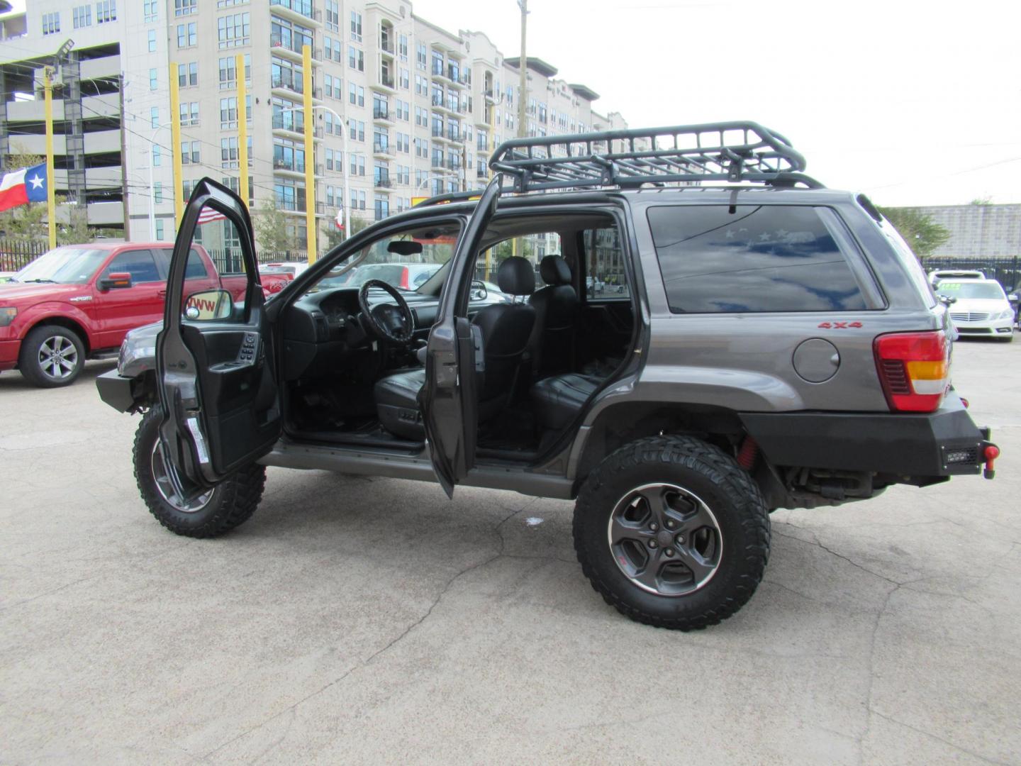 2002 Gray /Black Jeep Grand Cherokee Laredo 4WD (1J4GW48S32C) with an 4.0L L6 OHV 12V engine, 4-Speed Automatic Overdrive transmission, located at 1511 North Shepherd Dr., Houston, TX, 77008, (281) 657-1221, 29.798361, -95.412560 - 2002 JEEP GRAND CHEROKEE LAREDO VIN: 1J4GW48S32C228645 1 J 4 G W 4 8 S 3 2 C 2 2 8 6 4 5 4 DOOR WAGON/SPORT UTILITY 4.0L I6 F GASOLINE REAR WHEEL DRIVE W/ 4X4 - Photo#20