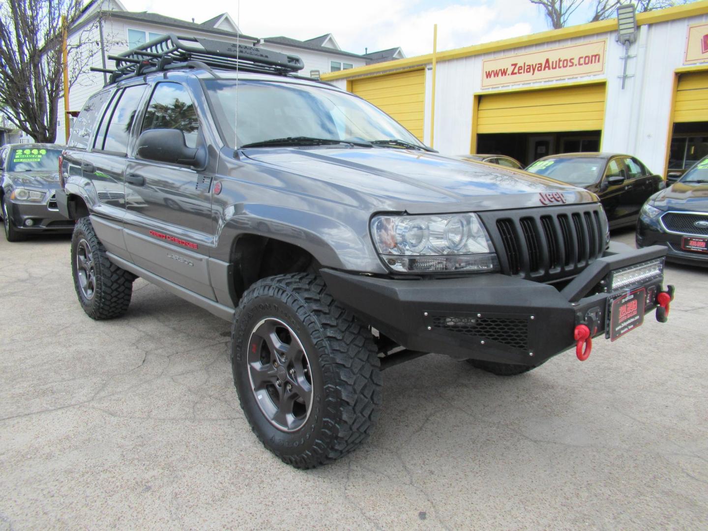 2002 Gray /Black Jeep Grand Cherokee Laredo 4WD (1J4GW48S32C) with an 4.0L L6 OHV 12V engine, 4-Speed Automatic Overdrive transmission, located at 1511 North Shepherd Dr., Houston, TX, 77008, (281) 657-1221, 29.798361, -95.412560 - 2002 JEEP GRAND CHEROKEE LAREDO VIN: 1J4GW48S32C228645 1 J 4 G W 4 8 S 3 2 C 2 2 8 6 4 5 4 DOOR WAGON/SPORT UTILITY 4.0L I6 F GASOLINE REAR WHEEL DRIVE W/ 4X4 - Photo#23