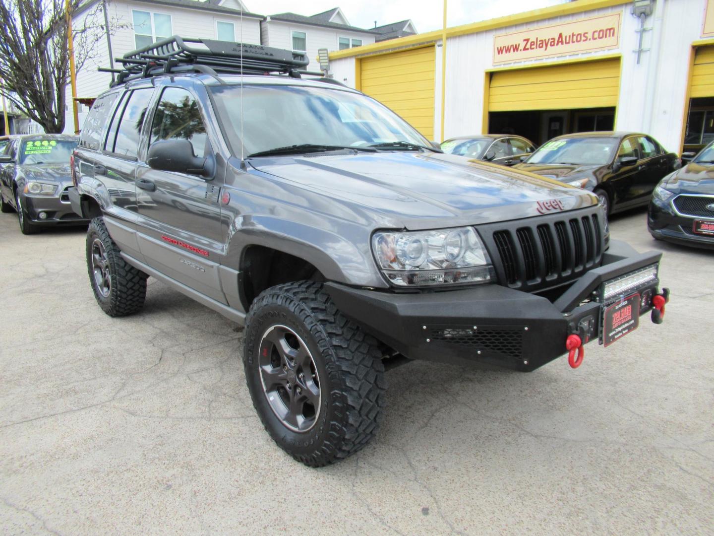 2002 Gray /Black Jeep Grand Cherokee Laredo 4WD (1J4GW48S32C) with an 4.0L L6 OHV 12V engine, 4-Speed Automatic Overdrive transmission, located at 1511 North Shepherd Dr., Houston, TX, 77008, (281) 657-1221, 29.798361, -95.412560 - 2002 JEEP GRAND CHEROKEE LAREDO VIN: 1J4GW48S32C228645 1 J 4 G W 4 8 S 3 2 C 2 2 8 6 4 5 4 DOOR WAGON/SPORT UTILITY 4.0L I6 F GASOLINE REAR WHEEL DRIVE W/ 4X4 - Photo#24