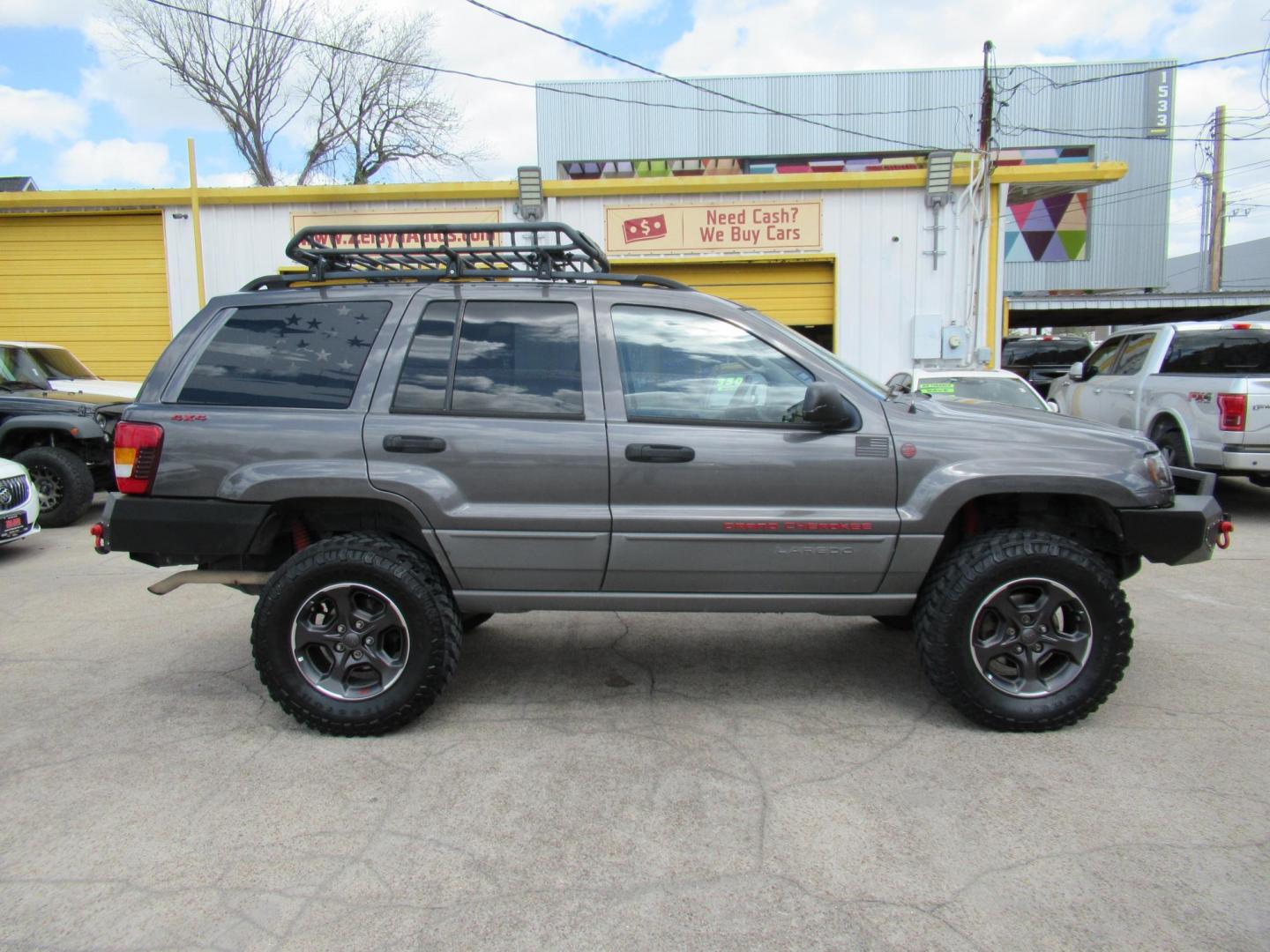 2002 Gray /Black Jeep Grand Cherokee Laredo 4WD (1J4GW48S32C) with an 4.0L L6 OHV 12V engine, 4-Speed Automatic Overdrive transmission, located at 1511 North Shepherd Dr., Houston, TX, 77008, (281) 657-1221, 29.798361, -95.412560 - 2002 JEEP GRAND CHEROKEE LAREDO VIN: 1J4GW48S32C228645 1 J 4 G W 4 8 S 3 2 C 2 2 8 6 4 5 4 DOOR WAGON/SPORT UTILITY 4.0L I6 F GASOLINE REAR WHEEL DRIVE W/ 4X4 - Photo#25