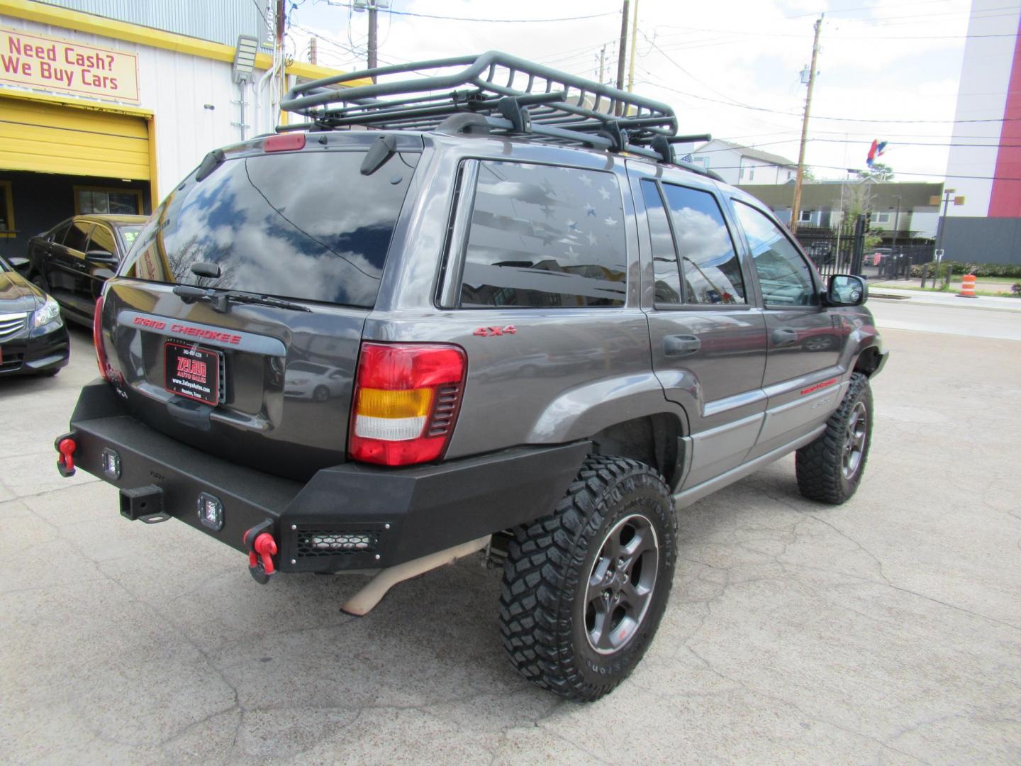 2002 Gray /Black Jeep Grand Cherokee Laredo 4WD (1J4GW48S32C) with an 4.0L L6 OHV 12V engine, 4-Speed Automatic Overdrive transmission, located at 1511 North Shepherd Dr., Houston, TX, 77008, (281) 657-1221, 29.798361, -95.412560 - 2002 JEEP GRAND CHEROKEE LAREDO VIN: 1J4GW48S32C228645 1 J 4 G W 4 8 S 3 2 C 2 2 8 6 4 5 4 DOOR WAGON/SPORT UTILITY 4.0L I6 F GASOLINE REAR WHEEL DRIVE W/ 4X4 - Photo#26