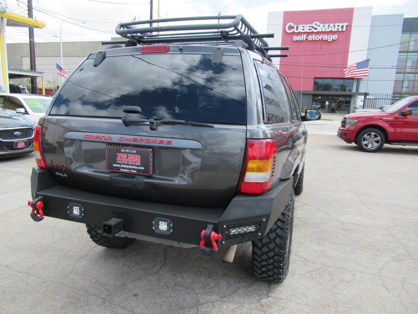 2002 Gray /Black Jeep Grand Cherokee Laredo 4WD (1J4GW48S32C) with an 4.0L L6 OHV 12V engine, 4-Speed Automatic Overdrive transmission, located at 1511 North Shepherd Dr., Houston, TX, 77008, (281) 657-1221, 29.798361, -95.412560 - 2002 JEEP GRAND CHEROKEE LAREDO VIN: 1J4GW48S32C228645 1 J 4 G W 4 8 S 3 2 C 2 2 8 6 4 5 4 DOOR WAGON/SPORT UTILITY 4.0L I6 F GASOLINE REAR WHEEL DRIVE W/ 4X4 - Photo#27