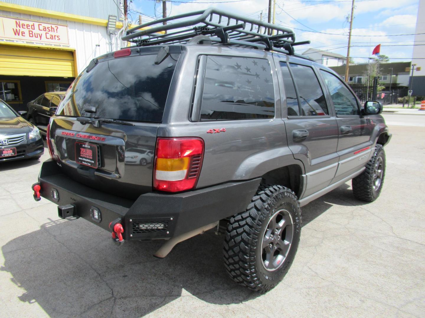 2002 Gray /Black Jeep Grand Cherokee Laredo 4WD (1J4GW48S32C) with an 4.0L L6 OHV 12V engine, 4-Speed Automatic Overdrive transmission, located at 1511 North Shepherd Dr., Houston, TX, 77008, (281) 657-1221, 29.798361, -95.412560 - 2002 JEEP GRAND CHEROKEE LAREDO VIN: 1J4GW48S32C228645 1 J 4 G W 4 8 S 3 2 C 2 2 8 6 4 5 4 DOOR WAGON/SPORT UTILITY 4.0L I6 F GASOLINE REAR WHEEL DRIVE W/ 4X4 - Photo#37