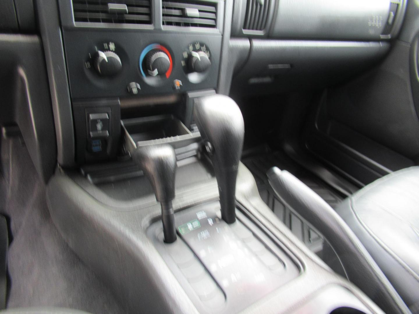 2002 Gray /Black Jeep Grand Cherokee Laredo 4WD (1J4GW48S32C) with an 4.0L L6 OHV 12V engine, 4-Speed Automatic Overdrive transmission, located at 1511 North Shepherd Dr., Houston, TX, 77008, (281) 657-1221, 29.798361, -95.412560 - 2002 JEEP GRAND CHEROKEE LAREDO VIN: 1J4GW48S32C228645 1 J 4 G W 4 8 S 3 2 C 2 2 8 6 4 5 4 DOOR WAGON/SPORT UTILITY 4.0L I6 F GASOLINE REAR WHEEL DRIVE W/ 4X4 - Photo#5
