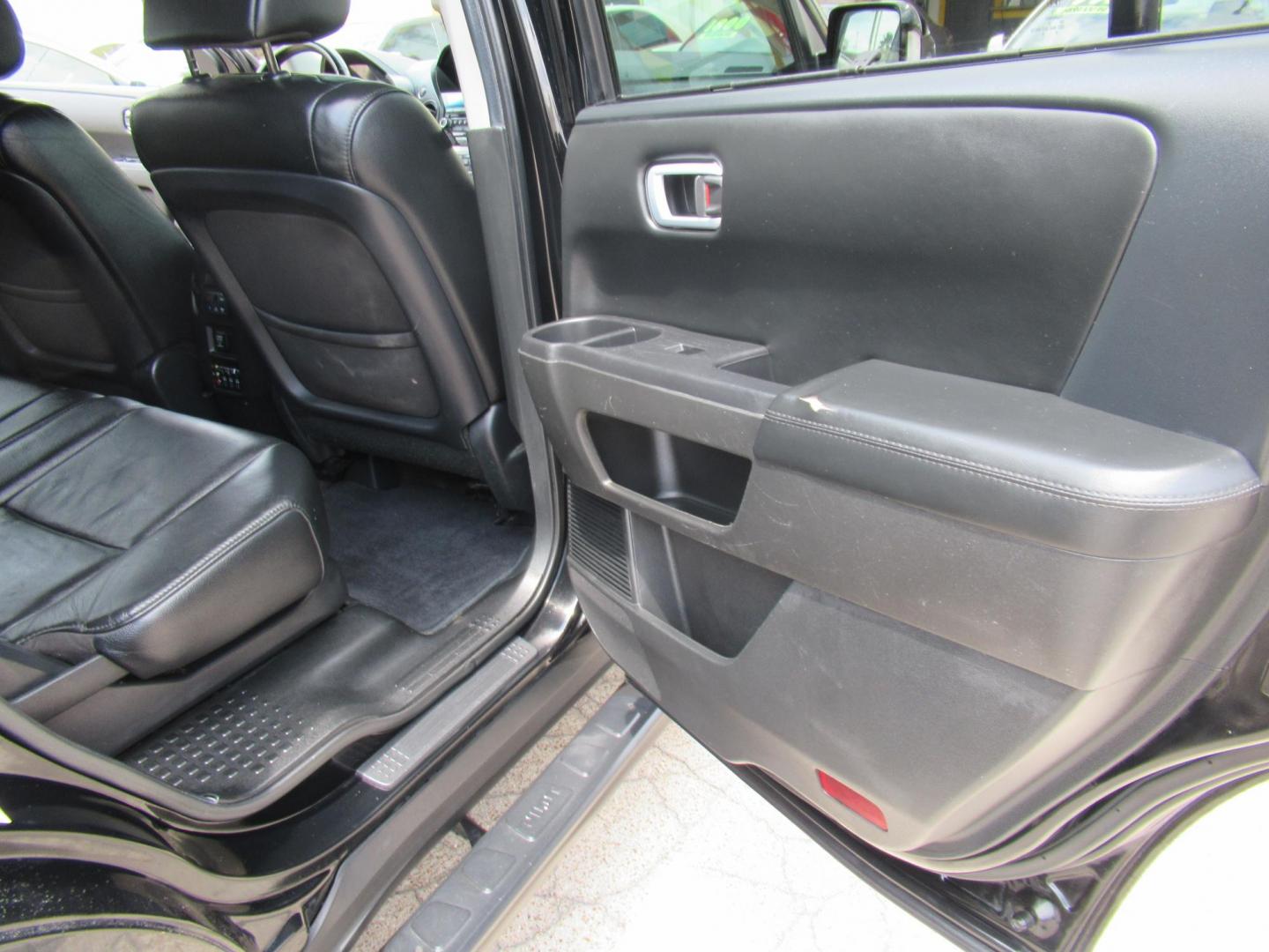2013 Black /Black Honda Pilot Touring 4WD 5-Spd AT with DVD (5FNYF4H90DB) with an 3.5L V6 SOHC 24V engine, Automatic transmission, located at 1511 North Shepherd Dr., Houston, TX, 77008, (281) 657-1221, 29.798361, -95.412560 - 2013 HONDA PILOT TOURING VIN: 5FNYF4H90DB016749 5 F N Y F 4 H 9 0 D B 0 1 6 7 4 9 4 DOOR WAGON/SPORT UTILITY 3.5L V6 F SOHC 24V GASOLINE ALL WHEEL DRIVE - Photo#16