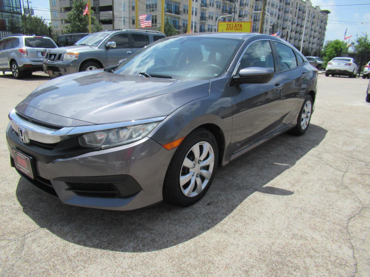 2017 Gray /Black Honda Civic LX Sedan CVT (19XFC2F51HE) with an 2.0L L4 DOHC 16V engine, CVT transmission, located at 1511 North Shepherd Dr., Houston, TX, 77008, (281) 657-1221, 29.798361, -95.412560 - 2017 HONDA CIVIC LX VIN: 19XFC2F51HE036413 1 9 X F C 2 F 5 1 H E 0 3 6 4 1 3 SEDAN 4 DR 2.0L I4 F DOHC 16V GASOLINE FRONT WHEEL DRIVE - Photo#19