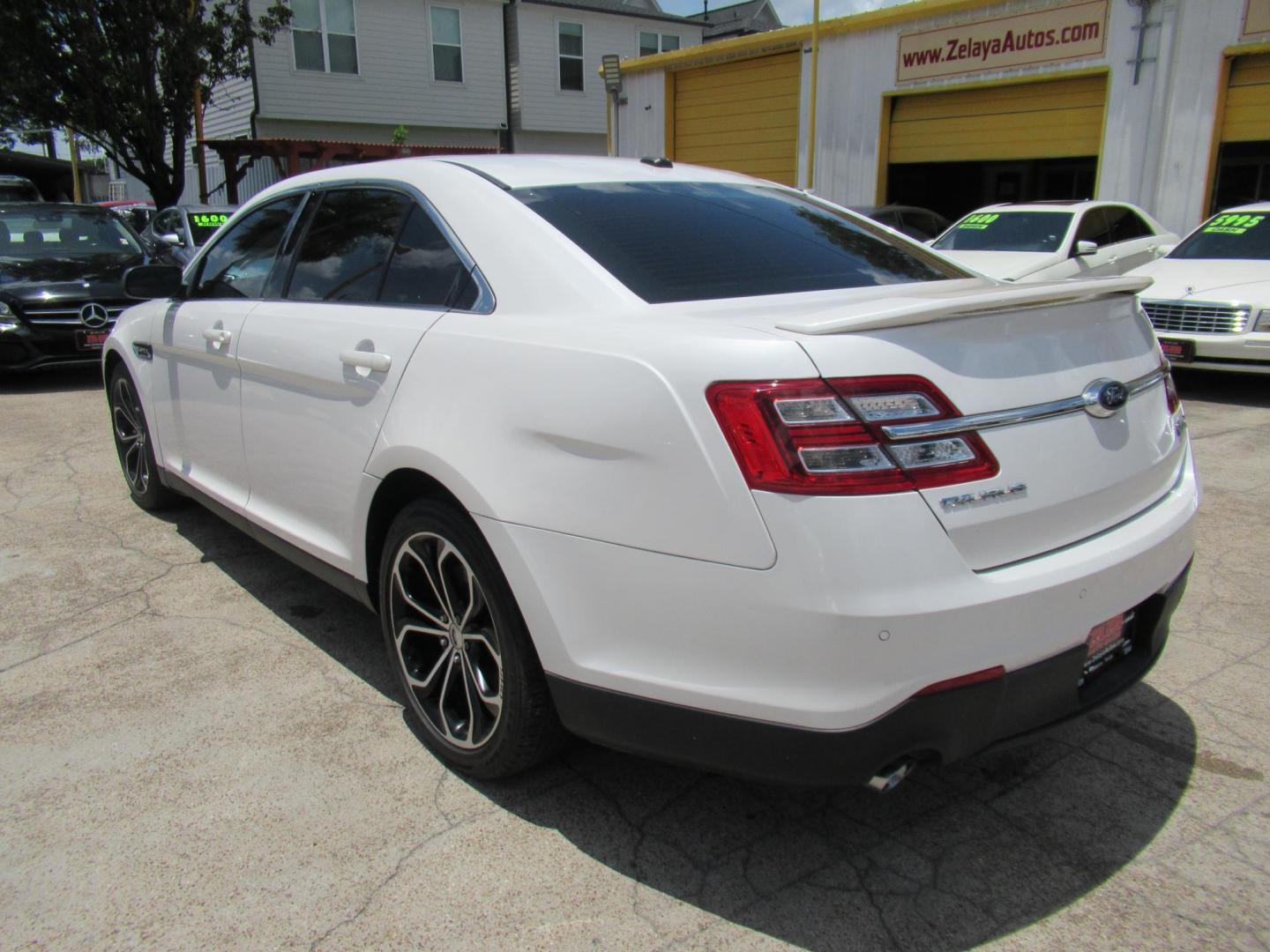 2013 White /Black Ford Taurus SHO AWD (1FAHP2KT8DG) with an 3.5L V6 DOHC 24V engine, 6-Speed Automatic transmission, located at 1511 North Shepherd Dr., Houston, TX, 77008, (281) 657-1221, 29.798361, -95.412560 - 2013 FORD TAURUS SHO VIN: 1FAHP2KT8DG169221 1 F A H P 2 K T 8 D G 1 6 9 2 2 1 SEDAN 4 DR 3.5L V6 F DOHC 16V GASOLINE ALL WHEEL DRIVE - Photo#18