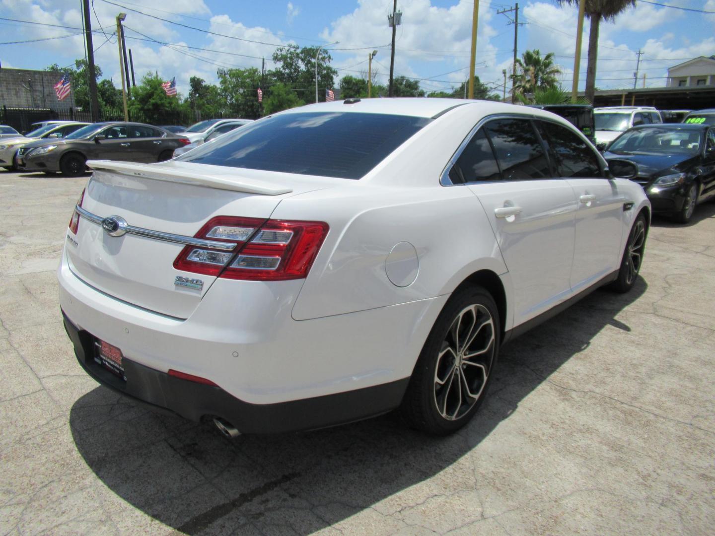 2013 White /Black Ford Taurus SHO AWD (1FAHP2KT8DG) with an 3.5L V6 DOHC 24V engine, 6-Speed Automatic transmission, located at 1511 North Shepherd Dr., Houston, TX, 77008, (281) 657-1221, 29.798361, -95.412560 - 2013 FORD TAURUS SHO VIN: 1FAHP2KT8DG169221 1 F A H P 2 K T 8 D G 1 6 9 2 2 1 SEDAN 4 DR 3.5L V6 F DOHC 16V GASOLINE ALL WHEEL DRIVE - Photo#20