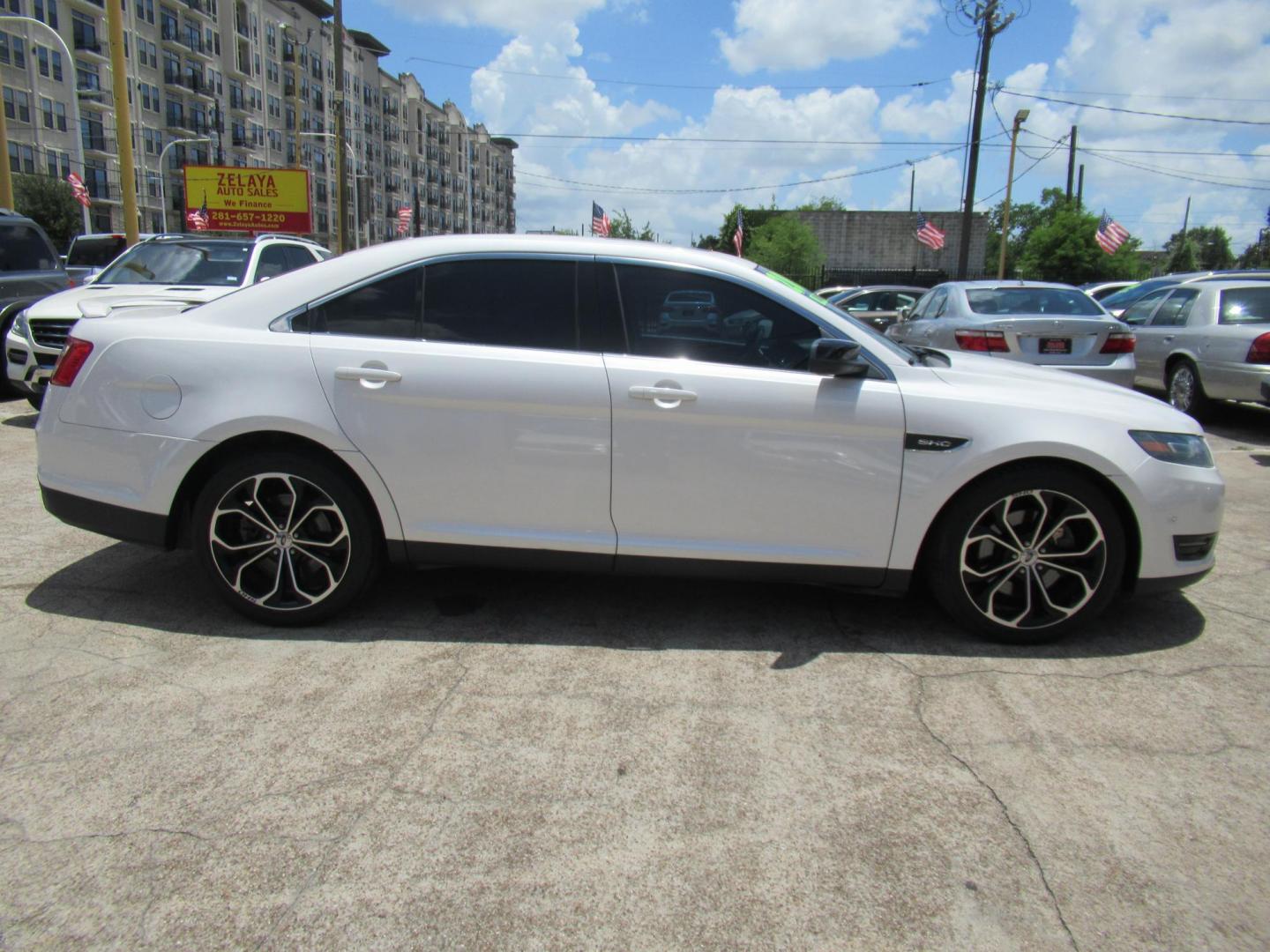 2013 White /Black Ford Taurus SHO AWD (1FAHP2KT8DG) with an 3.5L V6 DOHC 24V engine, 6-Speed Automatic transmission, located at 1511 North Shepherd Dr., Houston, TX, 77008, (281) 657-1221, 29.798361, -95.412560 - 2013 FORD TAURUS SHO VIN: 1FAHP2KT8DG169221 1 F A H P 2 K T 8 D G 1 6 9 2 2 1 SEDAN 4 DR 3.5L V6 F DOHC 16V GASOLINE ALL WHEEL DRIVE - Photo#21