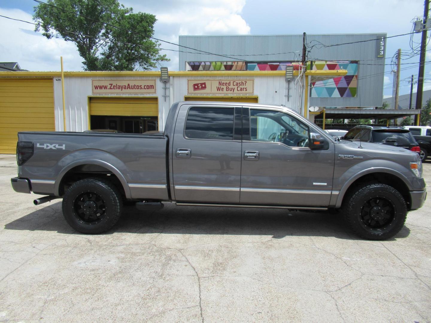 2014 Gray /Black Ford F-150 FX4 SuperCrew 5.5-ft. Bed 4WD (1FTFW1ET8EF) with an 3.5L V6 TURBO engine, Automatic transmission, located at 1511 North Shepherd Dr., Houston, TX, 77008, (281) 657-1221, 29.798361, -95.412560 - 2014 FORD F-150 PLATINUM VIN: 1FTFW1ET8EFA38064 1 F T F W 1 E T 8 E F A 3 8 0 6 4 CREW PICKUP 3.5L V6 F DOHC 24V GASOLINE REAR WHEEL DRIVE W/ 4X4 - Photo#0