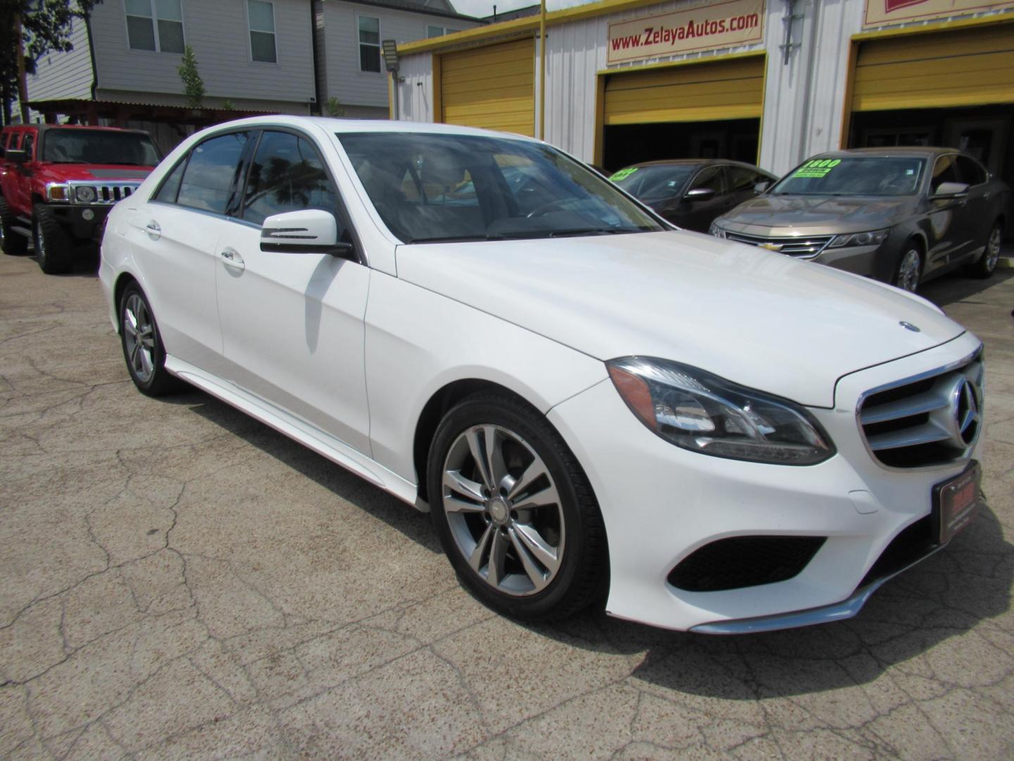 2015 White /Tan Mercedes-Benz E-Class E350 Sport Sedan (WDDHF5KBXFB) with an 3.5L V6 DOHC 24V engine, Automatic transmission, located at 1511 North Shepherd Dr., Houston, TX, 77008, (281) 657-1221, 29.798361, -95.412560 - 2015 MERCEDES-BENZ E-CLASS E 350 VIN: WDDHF5KBXFB117102 W D D H F 5 K B X F B 1 1 7 1 0 2 SEDAN 4 DR 3.5L V6 F DOHC 24V GASOLINE REAR WHEEL DRIVE - Photo#22