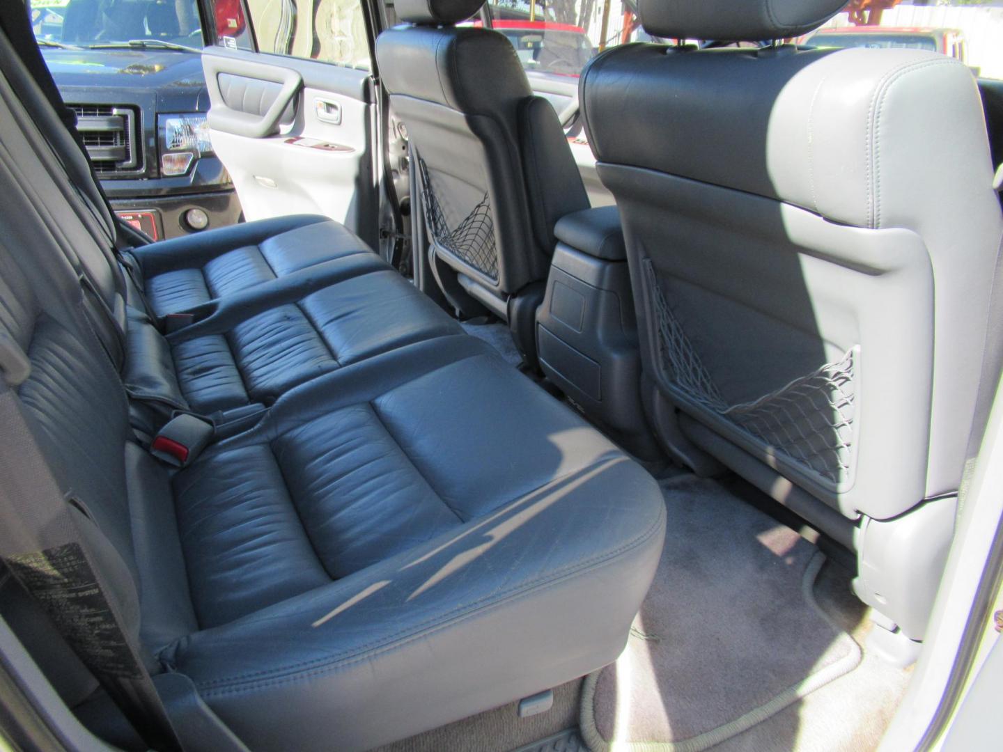 2001 Toyota Land Cruiser 4WD (JTEHT05J112) with an 4.7L V8 SOHC 16V engine, 4-Speed Automatic Overdrive transmission, located at 1511 North Shepherd Dr., Houston, TX, 77008, (281) 657-1221, 29.798361, -95.412560 - 2001 TOYOTA LAND CRUISER VIN: JTEHT05J112007701 J T E H T 0 5 J 1 1 2 0 0 7 7 0 1 4 DOOR WAGON/SPORT UTILITY 4.7L V8 F DOHC 32V GASOLINE ONE OWNER STRONG ENGINE CLEAN INTERIOR RUNS GREAT TRANSMISSION SHIFTS SMOOTH DONT MISS OUT ON THIS NICE LAND CRUISER ALL WHEEL DRIVE CASH OR CASHIERS - Photo#15