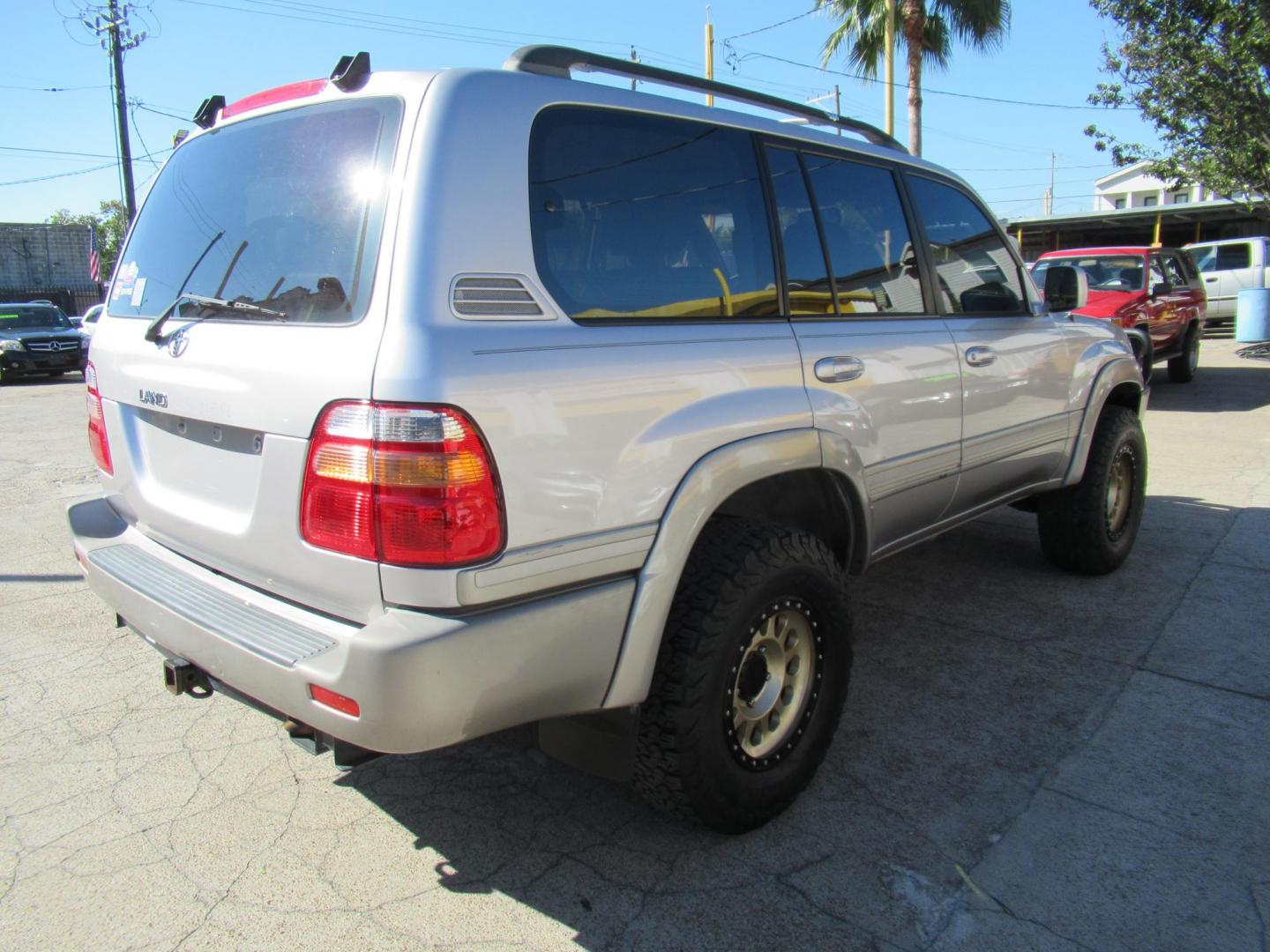 2001 Toyota Land Cruiser 4WD (JTEHT05J112) with an 4.7L V8 SOHC 16V engine, 4-Speed Automatic Overdrive transmission, located at 1511 North Shepherd Dr., Houston, TX, 77008, (281) 657-1221, 29.798361, -95.412560 - 2001 TOYOTA LAND CRUISER VIN: JTEHT05J112007701 J T E H T 0 5 J 1 1 2 0 0 7 7 0 1 4 DOOR WAGON/SPORT UTILITY 4.7L V8 F DOHC 32V GASOLINE ONE OWNER STRONG ENGINE CLEAN INTERIOR RUNS GREAT TRANSMISSION SHIFTS SMOOTH DONT MISS OUT ON THIS NICE LAND CRUISER ALL WHEEL DRIVE CASH OR CASHIERS - Photo#38