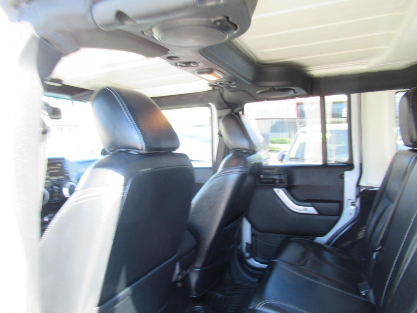 2014 Silver /Black Jeep Wrangler Unlimited Rubicon 4WD (1C4BJWFG2EL) with an 3.6L V6 DOHC 24V FFV engine, Automatic transmission, located at 1511 North Shepherd Dr., Houston, TX, 77008, (281) 657-1221, 29.798361, -95.412560 - 2014 JEEP WRANGLER UNLIMITED RUBICON VIN: 1C4BJWFG2EL325106 1 C 4 B J W F G 2 E L 3 2 5 1 0 6 4 DOOR WAGON/SPORT UTILITY 3.6L V6 F DOHC 24V GASOLINE REAR WHEEL DRIVE W/ 4X4 - Photo#13