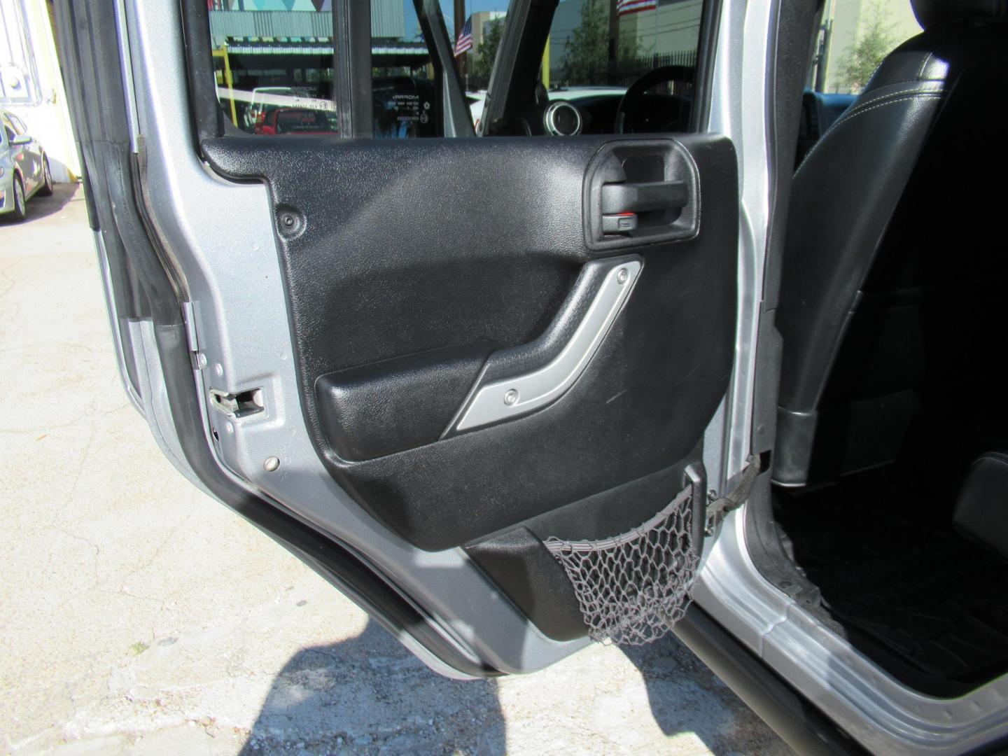 2014 Silver /Black Jeep Wrangler Unlimited Rubicon 4WD (1C4BJWFG2EL) with an 3.6L V6 DOHC 24V FFV engine, Automatic transmission, located at 1511 North Shepherd Dr., Houston, TX, 77008, (281) 657-1221, 29.798361, -95.412560 - 2014 JEEP WRANGLER UNLIMITED RUBICON VIN: 1C4BJWFG2EL325106 1 C 4 B J W F G 2 E L 3 2 5 1 0 6 4 DOOR WAGON/SPORT UTILITY 3.6L V6 F DOHC 24V GASOLINE REAR WHEEL DRIVE W/ 4X4 - Photo#14