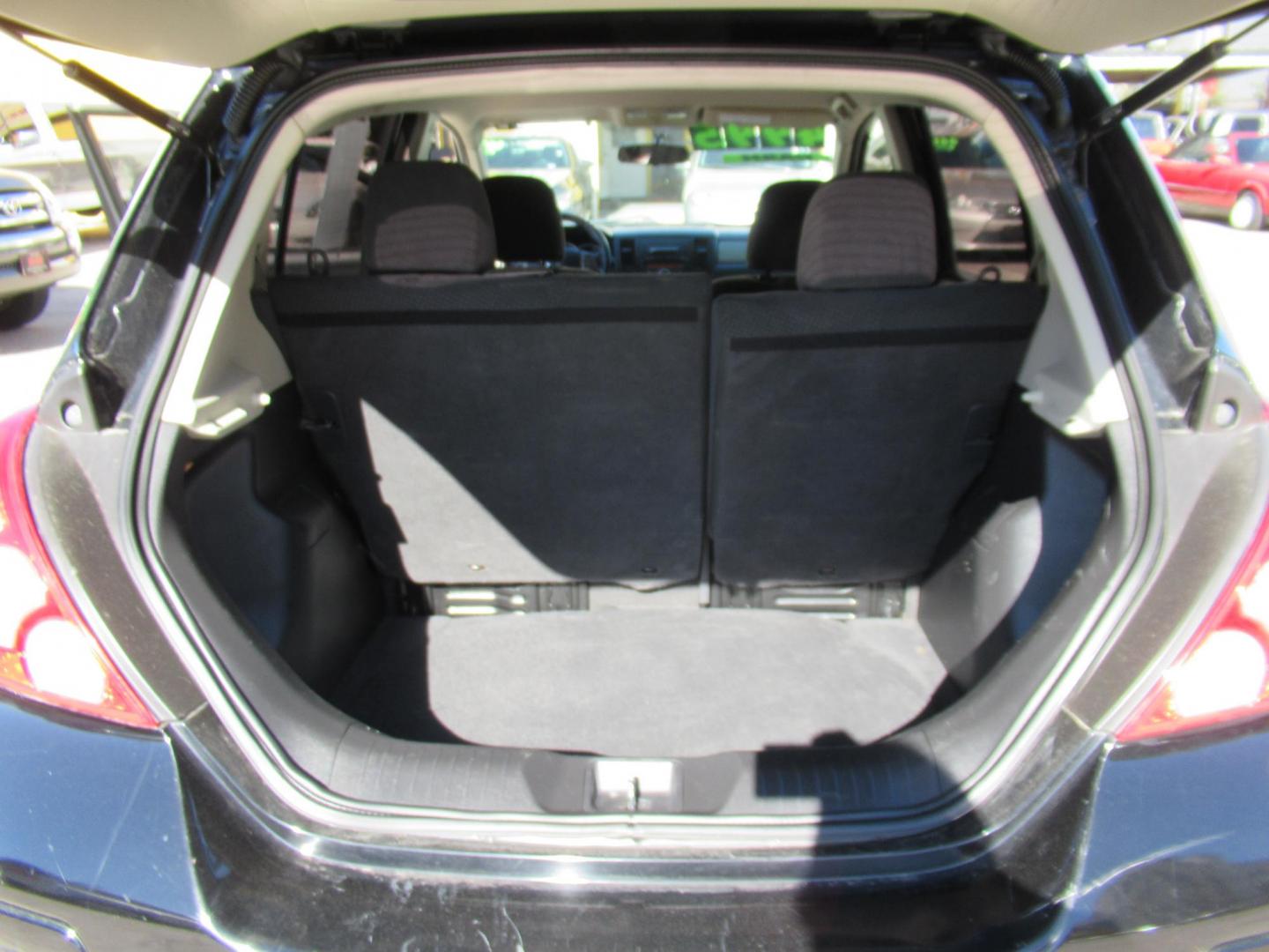 2012 Black /Black Nissan Versa 1.8 SL Hatchback (3N1BC1CP0CK) with an 1.8L L4 DOHC 16V engine, Continuously Variable Transmission transmission, located at 1511 North Shepherd Dr., Houston, TX, 77008, (281) 657-1221, 29.798361, -95.412560 - 2012 NISSAN VERSA 1.8 S VIN: 3N1BC1CP0CK257268 3 N 1 B C 1 C P 0 C K 2 5 7 2 6 8 HATCHBACK 4 DR 1.8L I4 F DOHC 16V GASOLINE FRONT WHEEL DRIVE - Photo#8